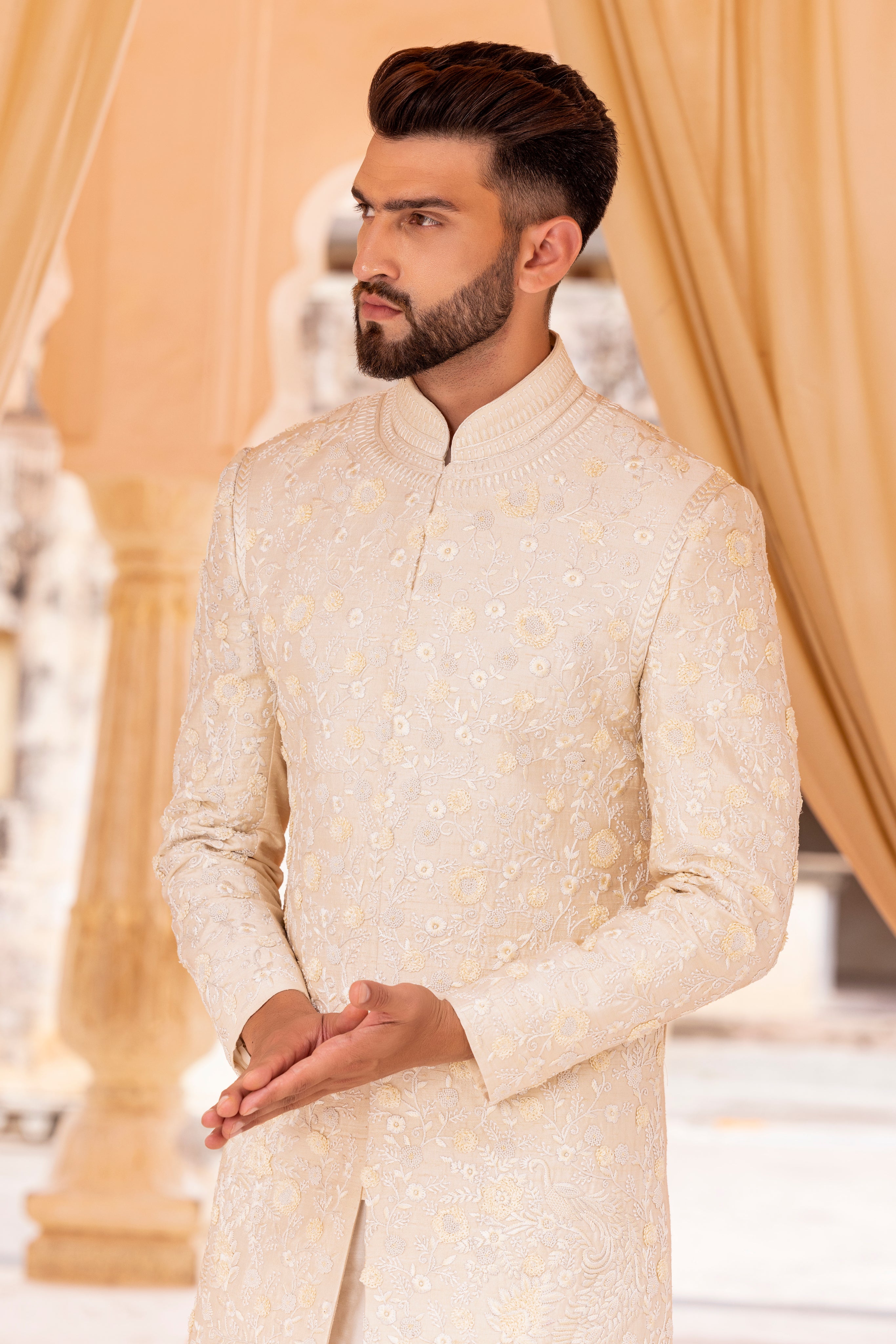 Hand embroidered sherwani paired with matching kurta, pyjama & stole.