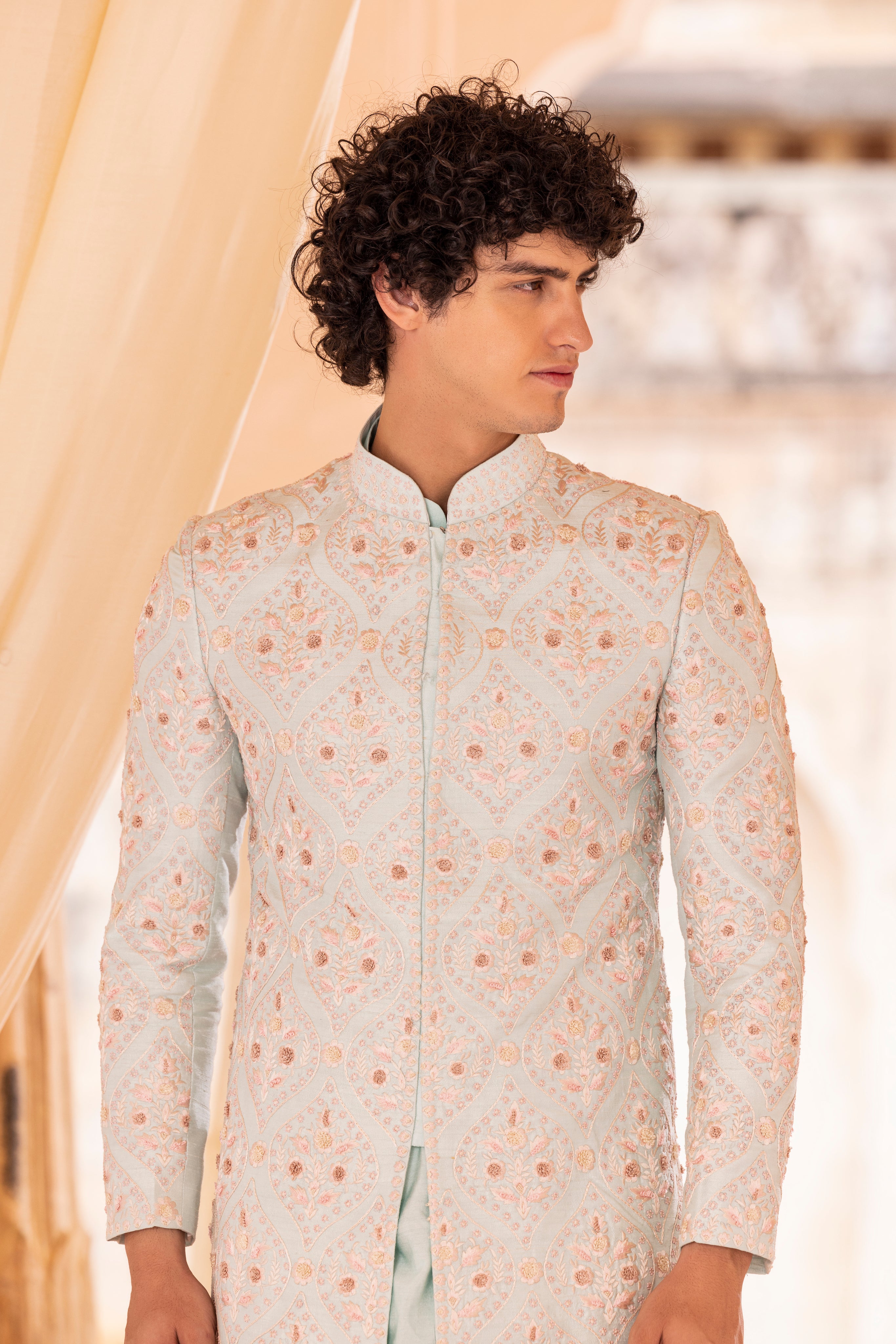 Hand embroidered sherwani paired with matching kurta, pyjama & stole.