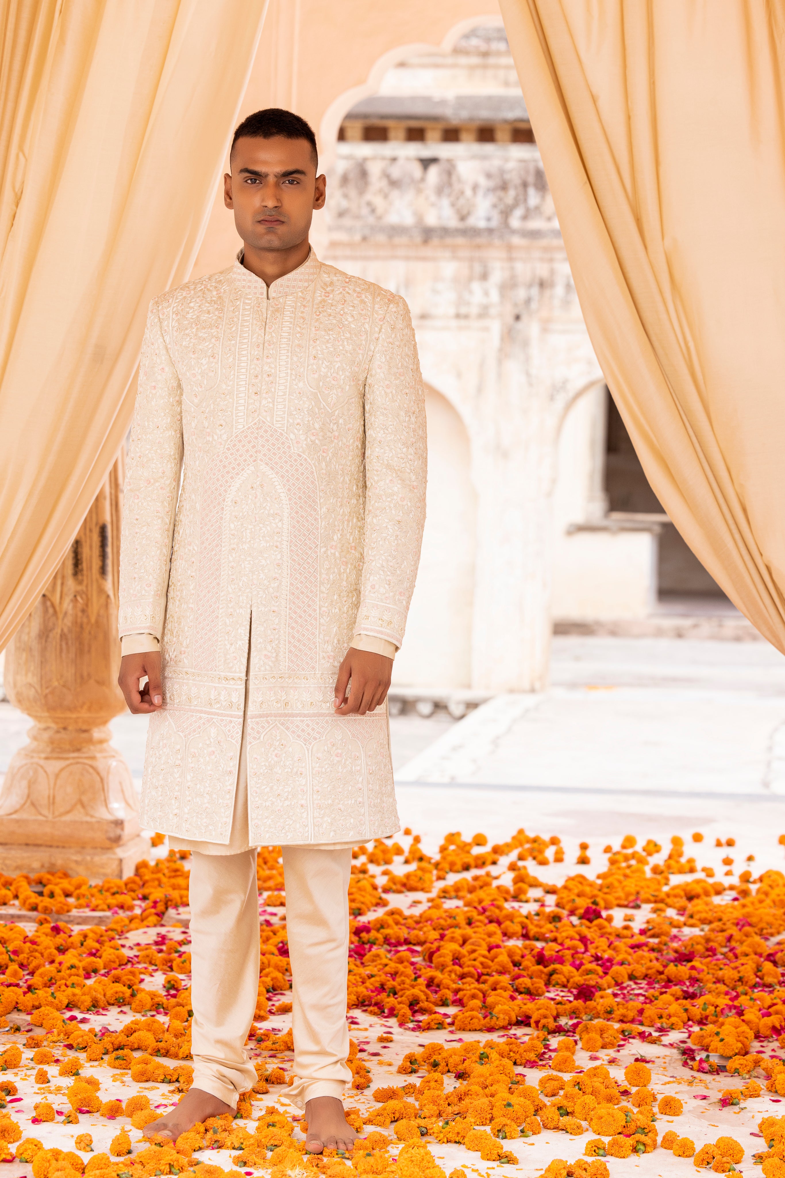 Hand embroidered sherwani paired with matching kurta, pyjama & stole.