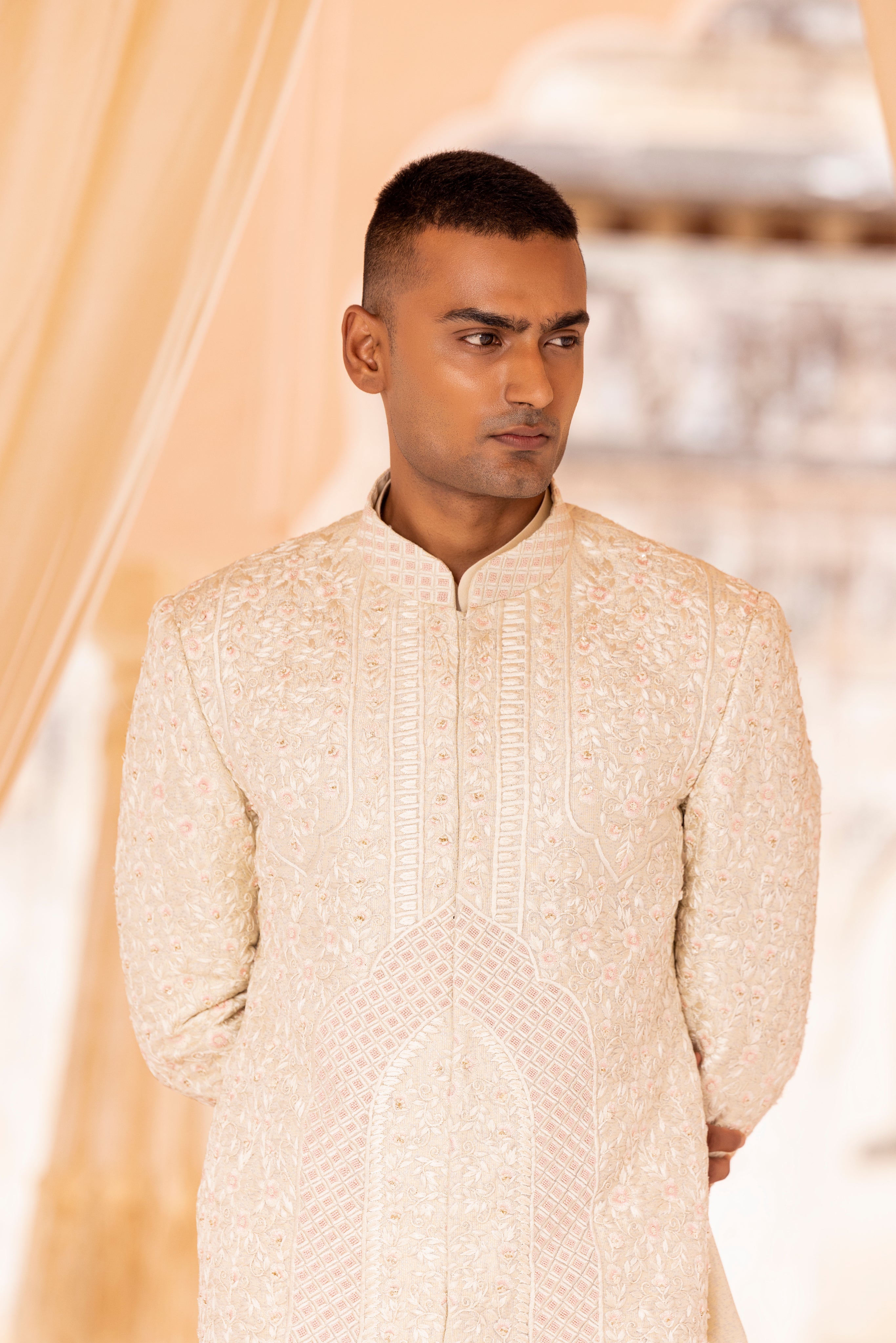 Hand embroidered sherwani paired with matching kurta, pyjama & stole.