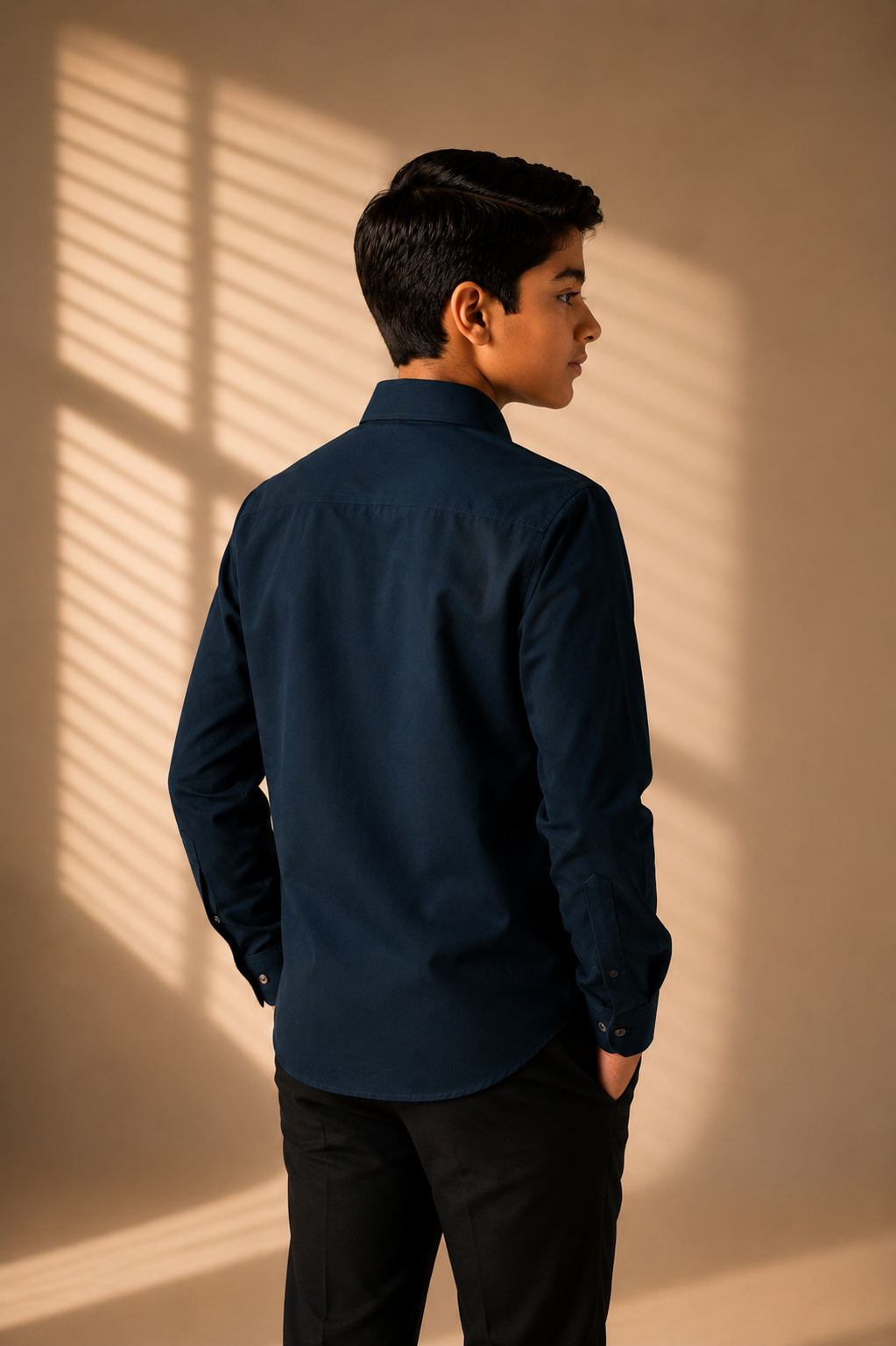 Turquoise shirt with hand-embroidered metal motif