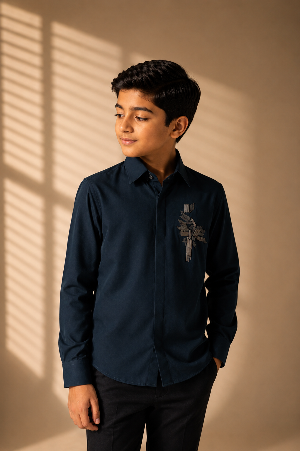 Turquoise shirt with hand-embroidered metal motif