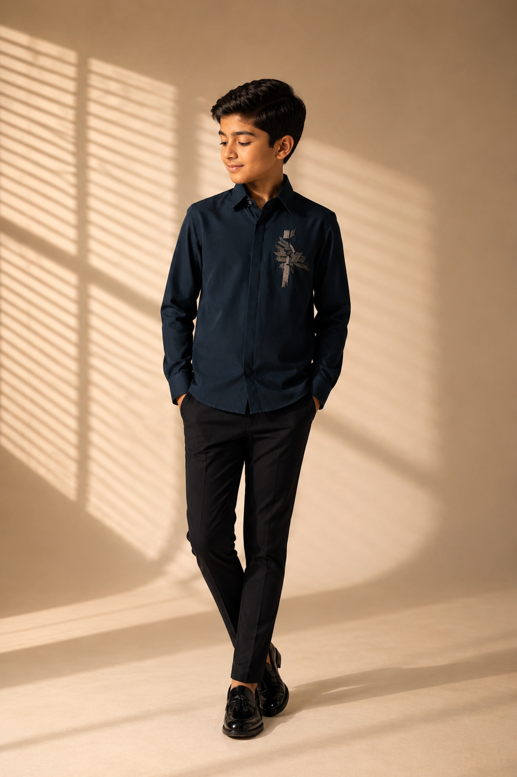 Turquoise shirt with hand-embroidered metal motif