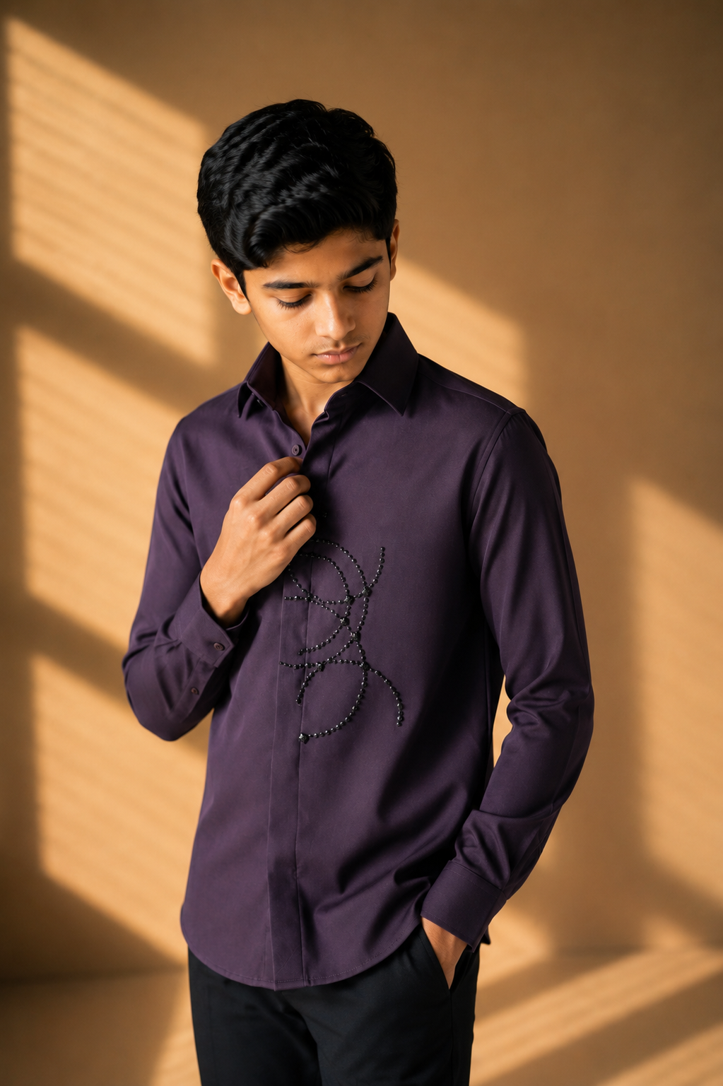 Purple shirt with abstract hand-embroidered metal motif