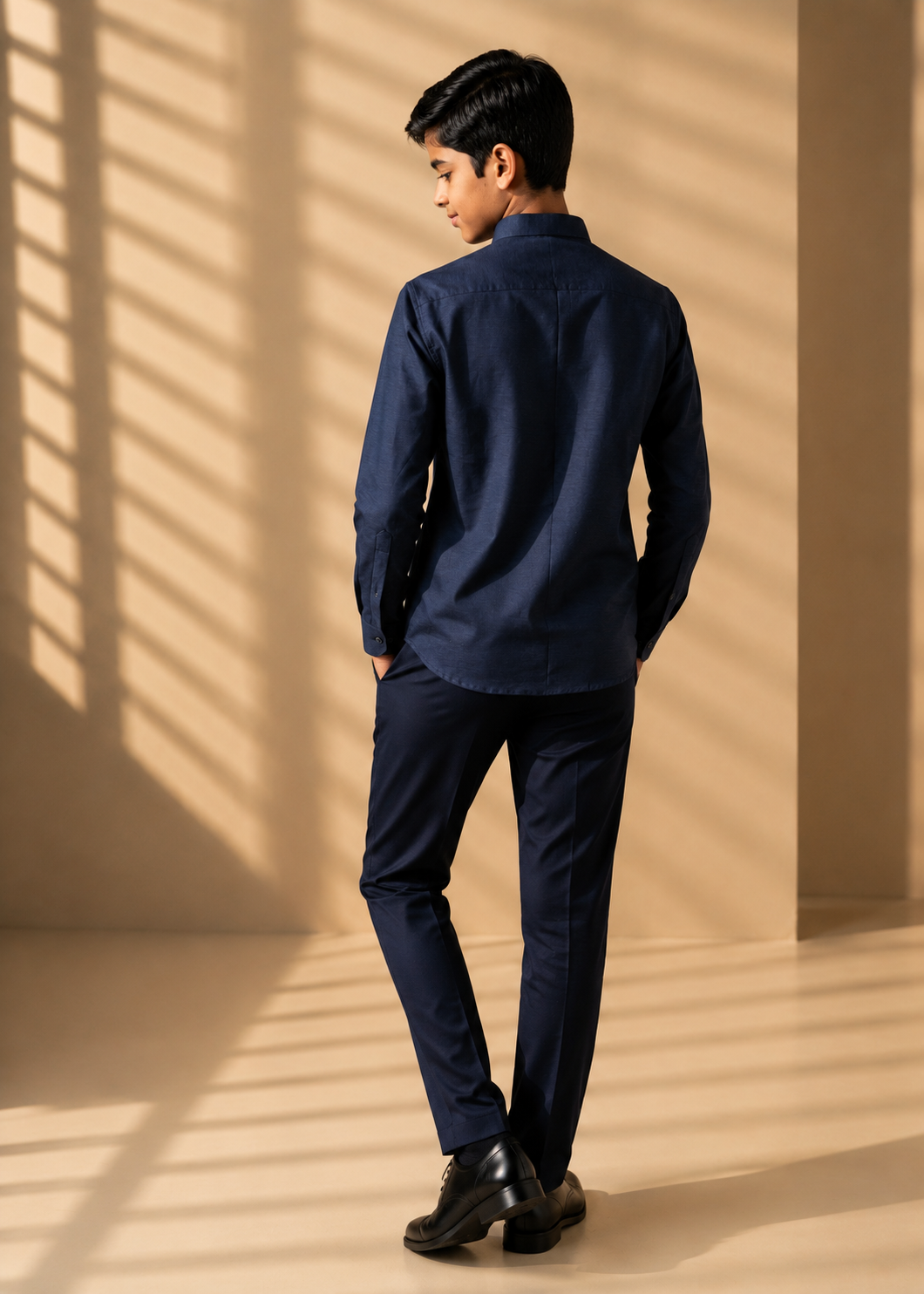 Blue knit shirt with hand-embroidered bird motif on Mandarin collar