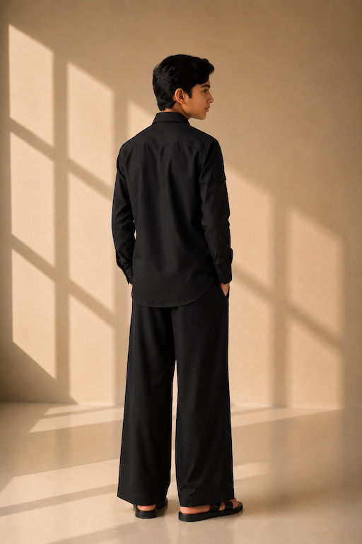 Black crepe shirt with hidden button placket and thread embroidery detailing, paired with a matching plazzo