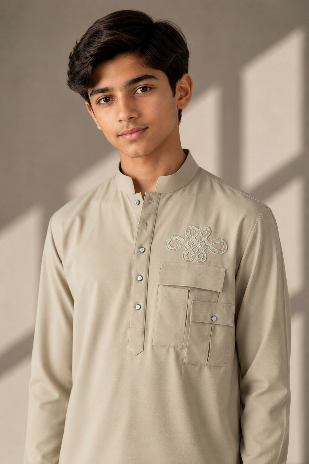 Beige short crepe kurta with patch pocket & thread embroidery detailing, paired with a matching plazzo