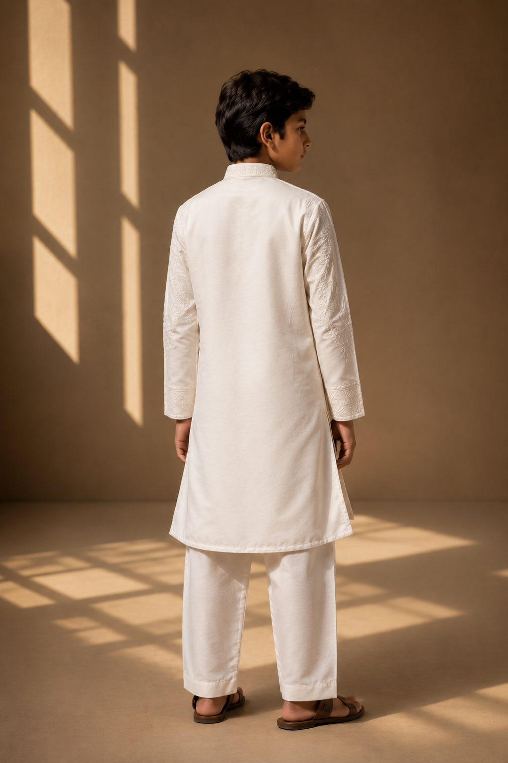 Featuring ivory slik linen kurta with front pannel embroidery with dori paired with aligarhi pants. Perfect attire for day pre wedding occaions