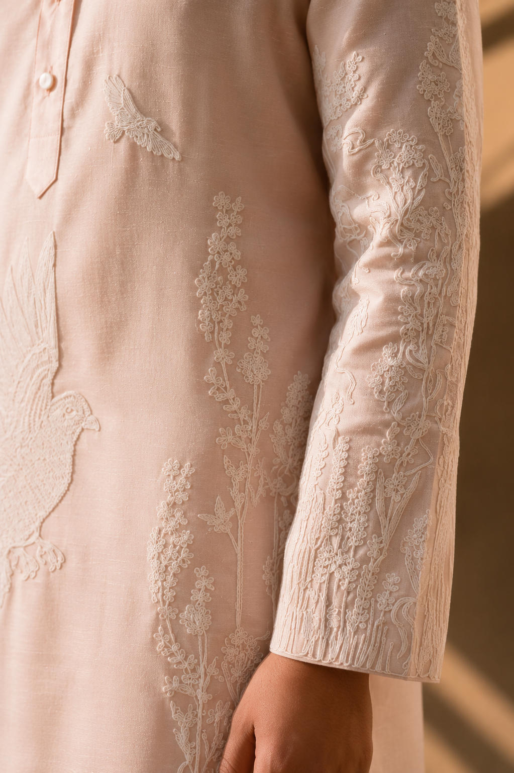 Featuring pink silk linen kurta with ivory dori embroidery on front pannel paired with aligarhi pants. Perfect ensemble for pre wedding occasions