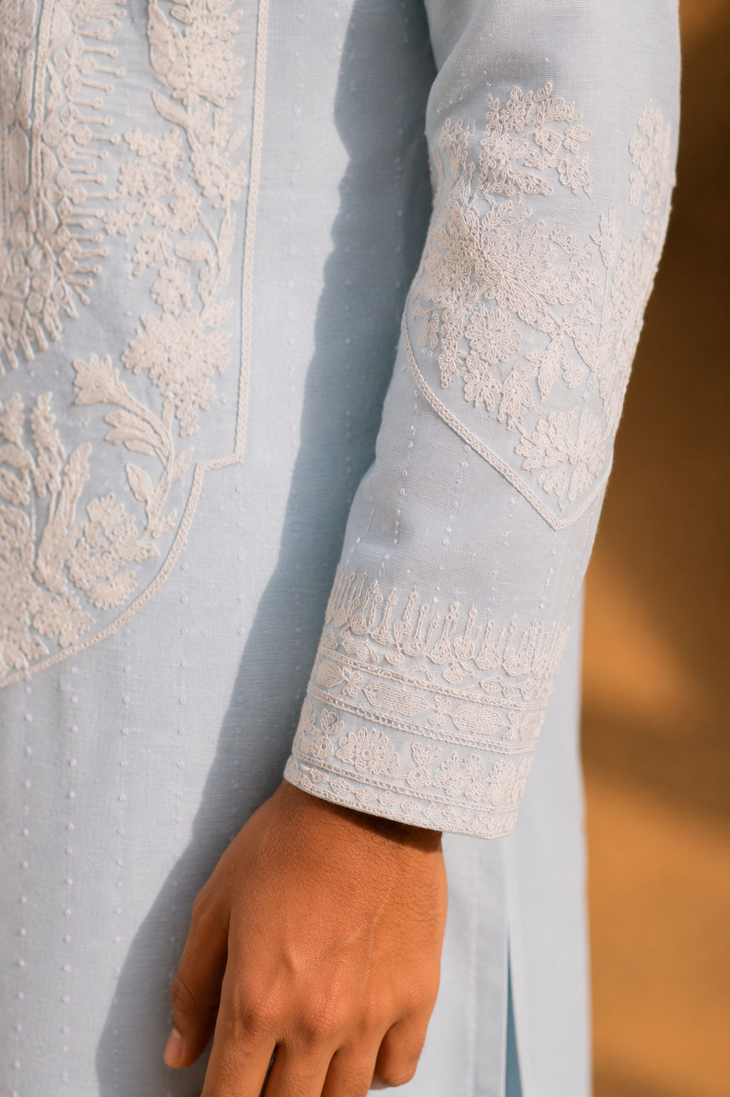 Featuring sky blue silk linen kurta highlighted with persian inspired embroidery pannel in dori embelished with hand embroidery paired with aligarhi pants. Perfrect ensemble for pre wedding occaions