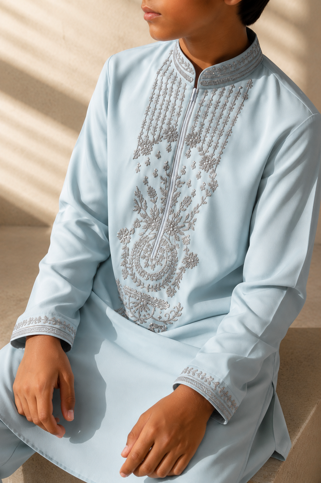 Featuring teal knit kurta embelished with metal components on front placket cuffs and collar paired with aligarhi pants