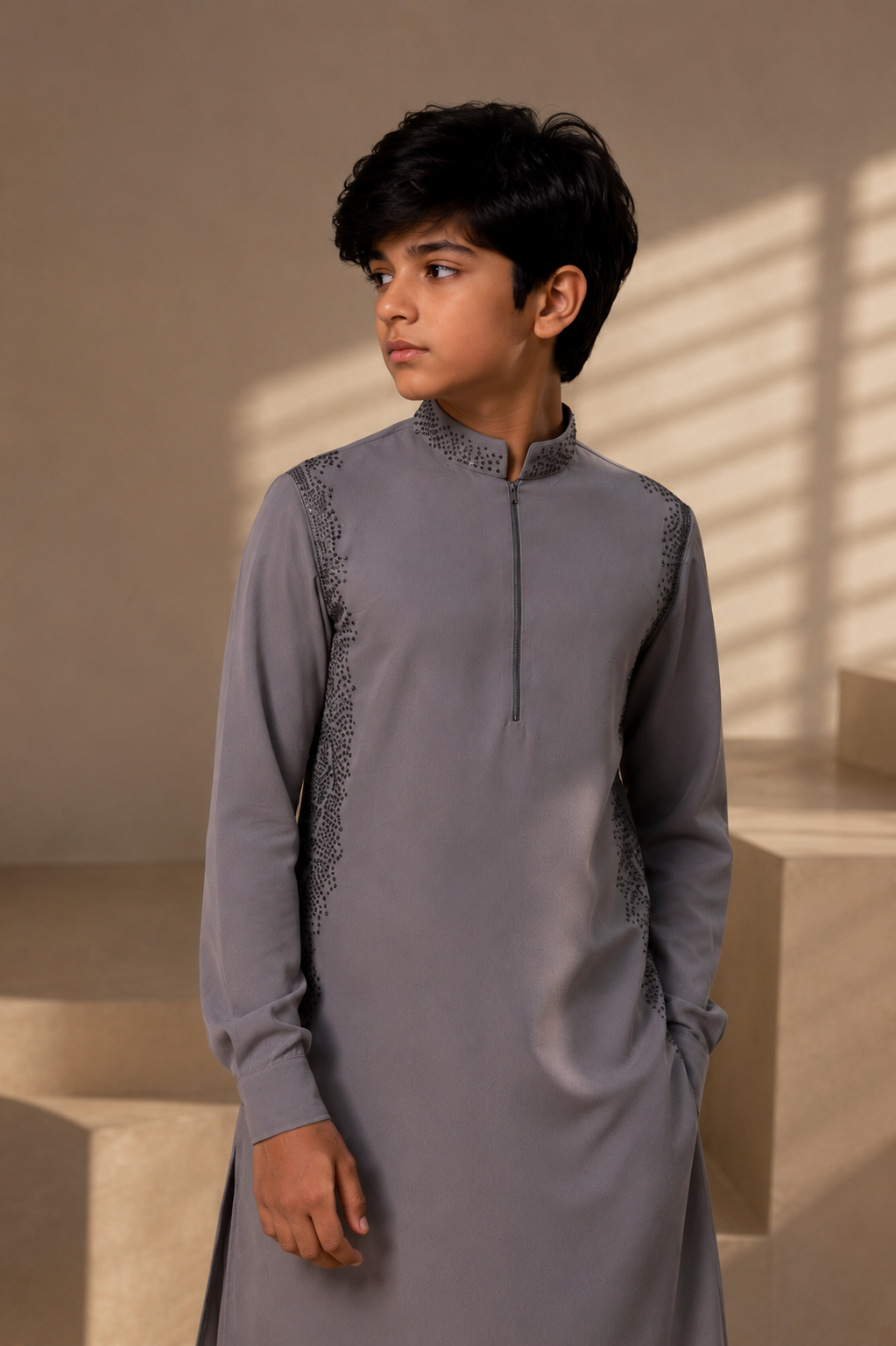 Featuring grey knit kurta enhanced with antique grey metal beads in grading pattern paired with aligarhi pants