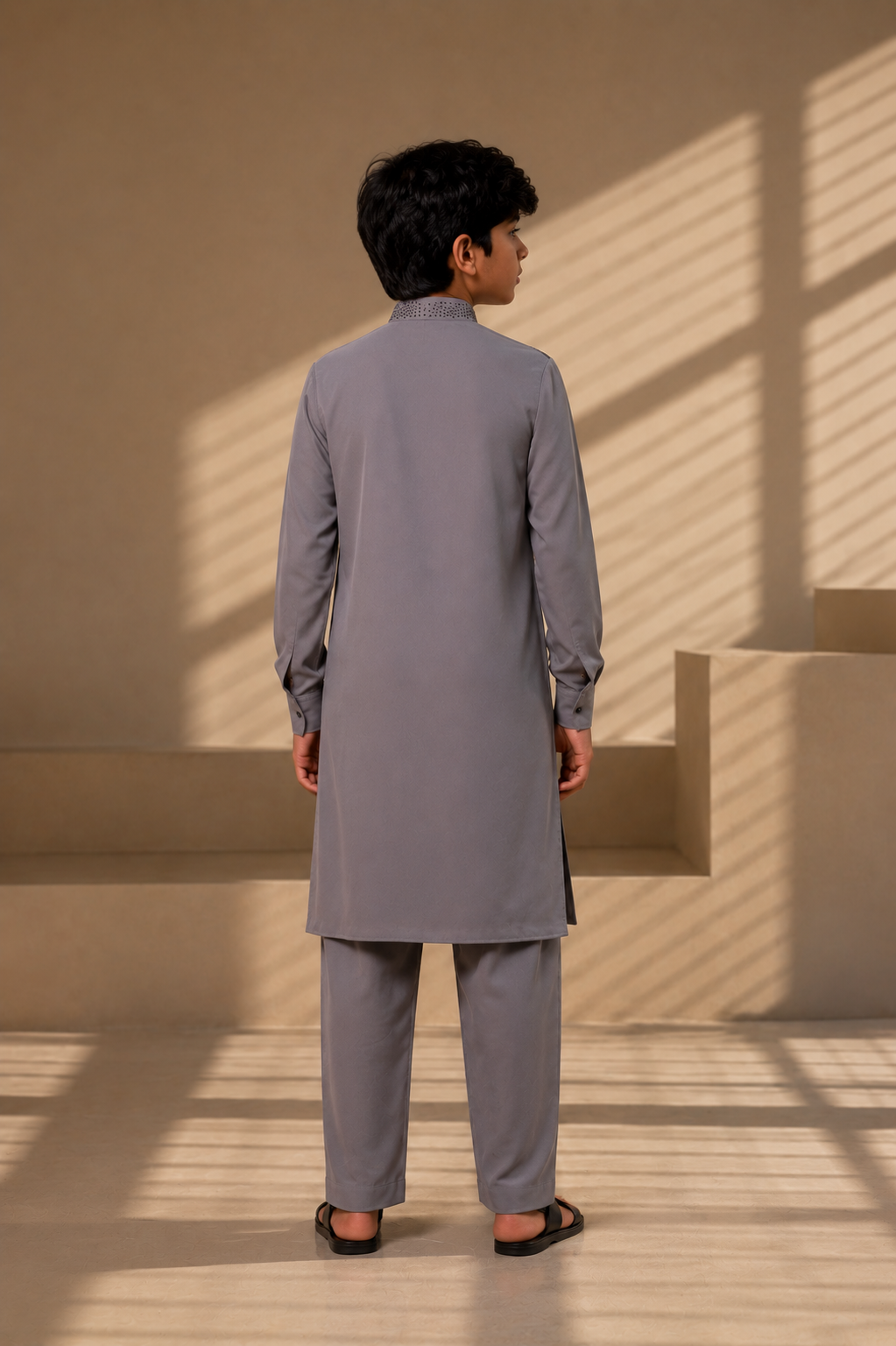 Featuring grey knit kurta enhanced with antique grey metal beads in grading pattern paired with aligarhi pants
