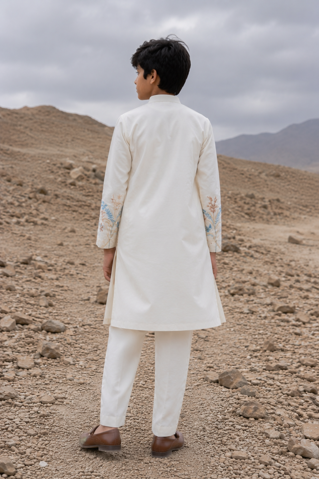 Featuring ivory silk kurta with bottom pannel and sleeves embroidery inpsired by asian art form paired with aligarhi pants. Perfrect attire to be worn in day wedding functions
