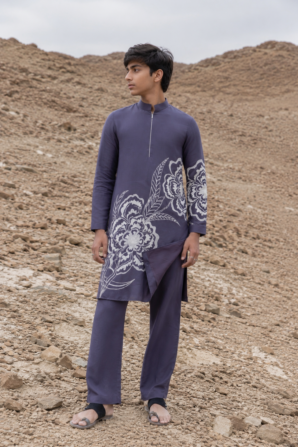 Featuring grey silk fusion kurta with enhanced floral motif in machine embroidery paired with aligarhi pants. Perfect ensemble for pre wedding occaions