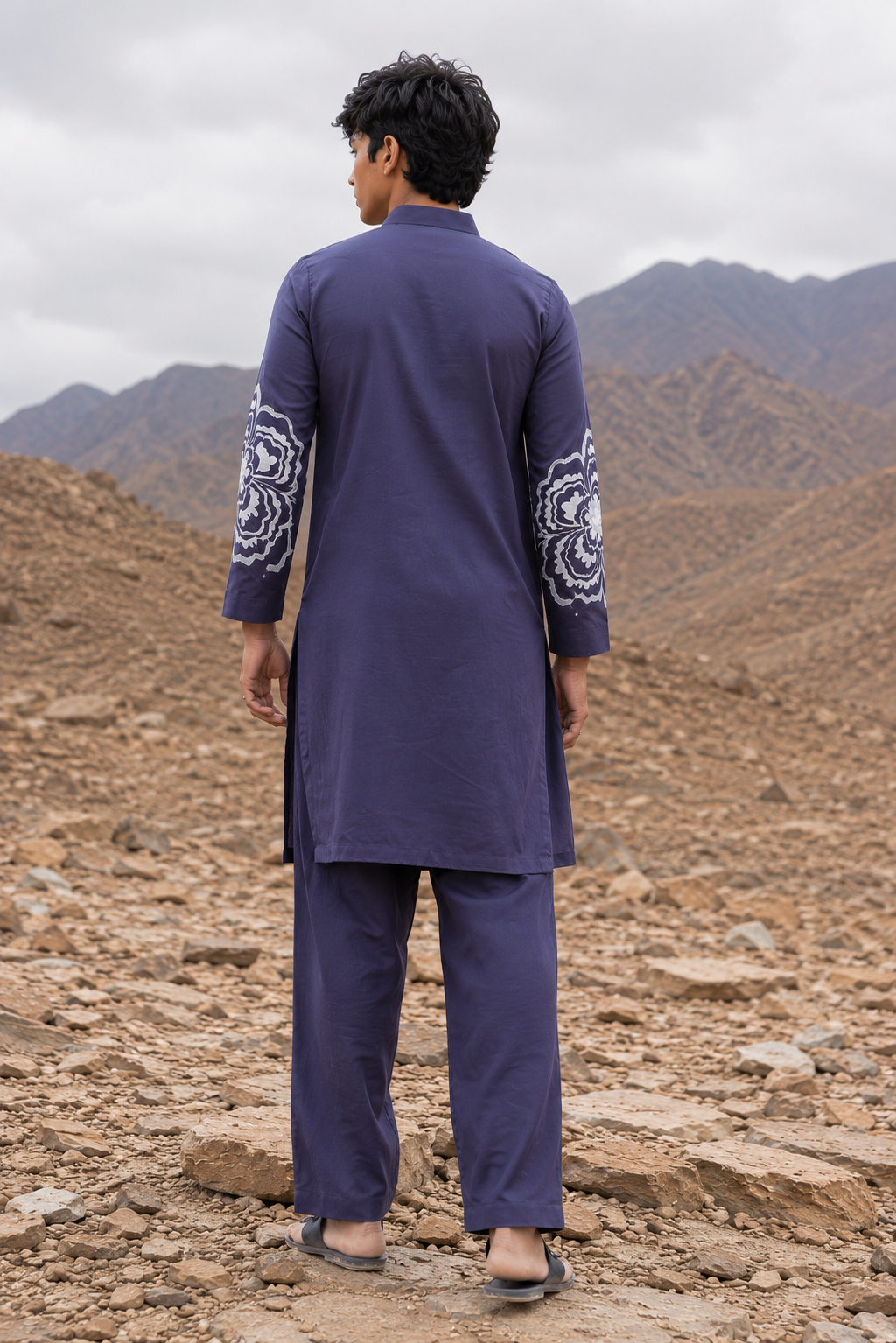 Featuring grey silk fusion kurta with enhanced floral motif in machine embroidery paired with aligarhi pants. Perfect ensemble for pre wedding occaions