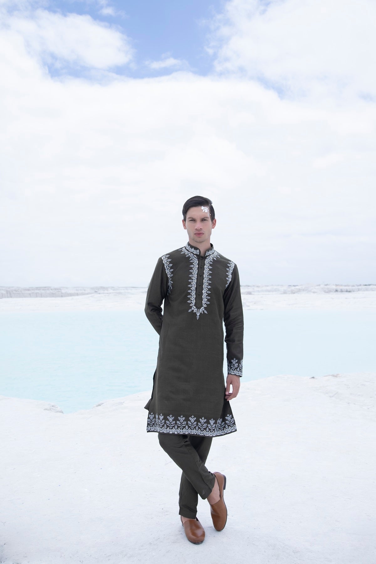 Banarasi silk kurta embellished with metal studs paired with Alighari pyjami