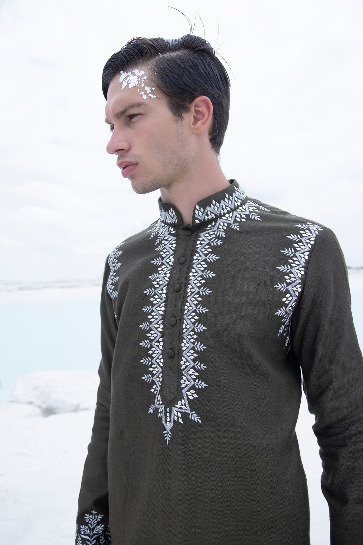 Banarasi silk kurta embellished with metal studs paired with Alighari pyjami