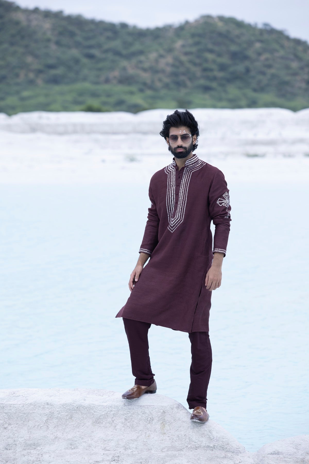 Banarasi silk kurta embellished with metal studs paired with Alighari pyjami