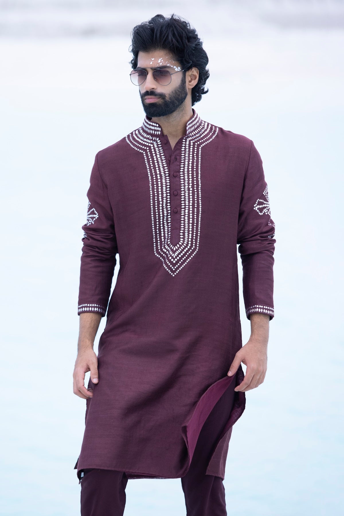 Banarasi silk kurta embellished with metal studs paired with Alighari pyjami