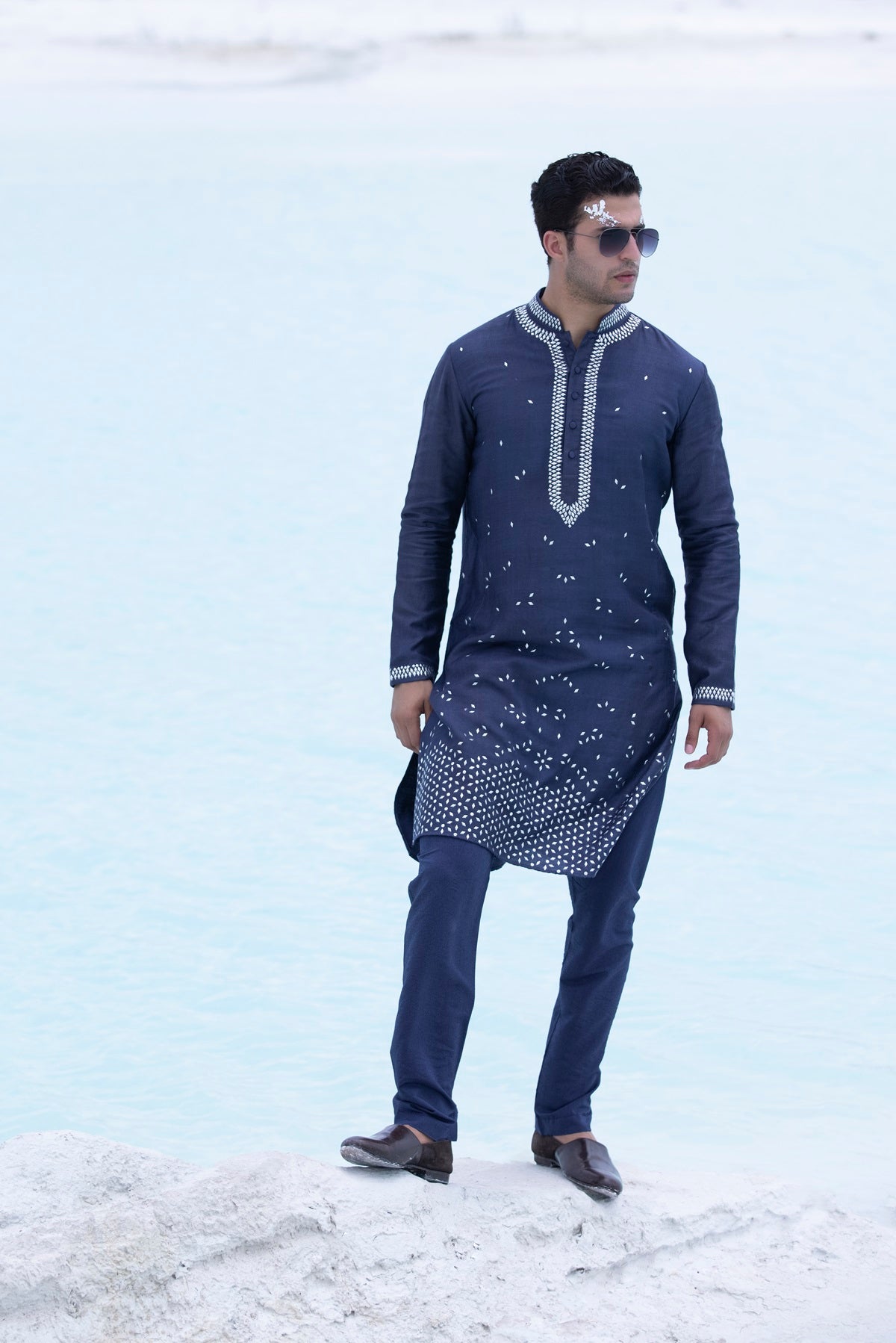 Banarasi silk kurta embellished with metal studs paired with Alighari pyjami