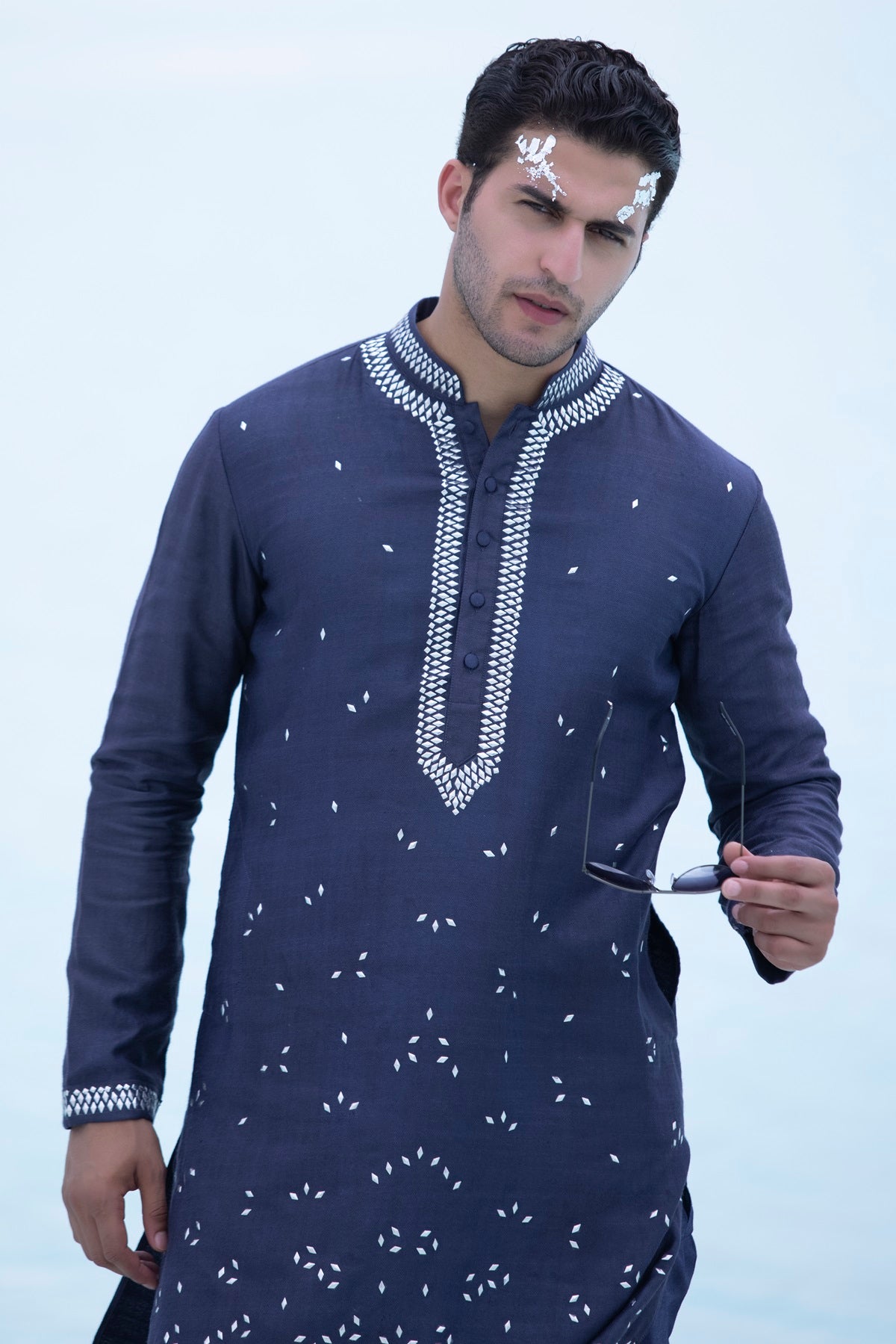 Banarasi silk kurta embellished with metal studs paired with Alighari pyjami