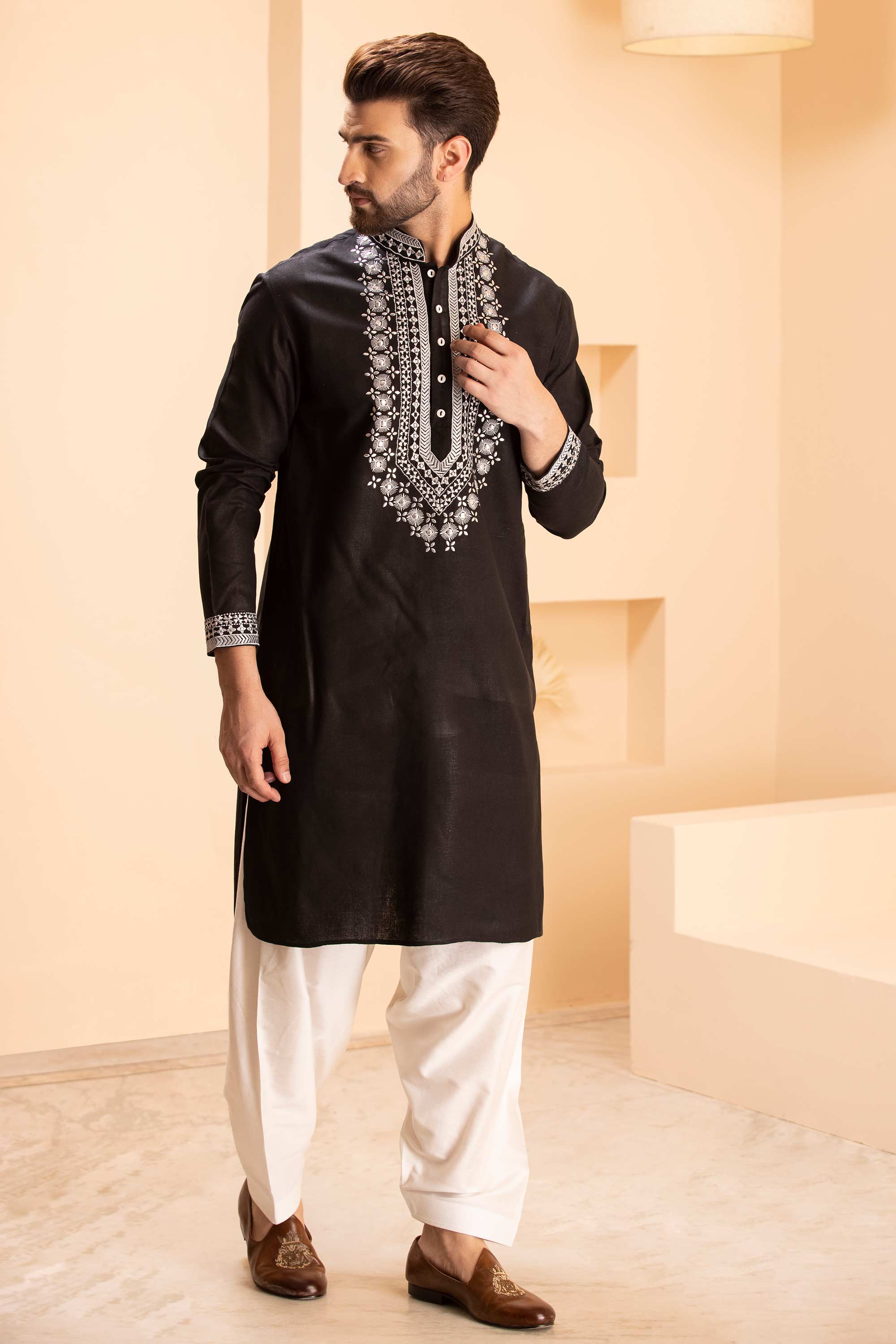Linen kurta with zari embroidery & metal work paired with salwar