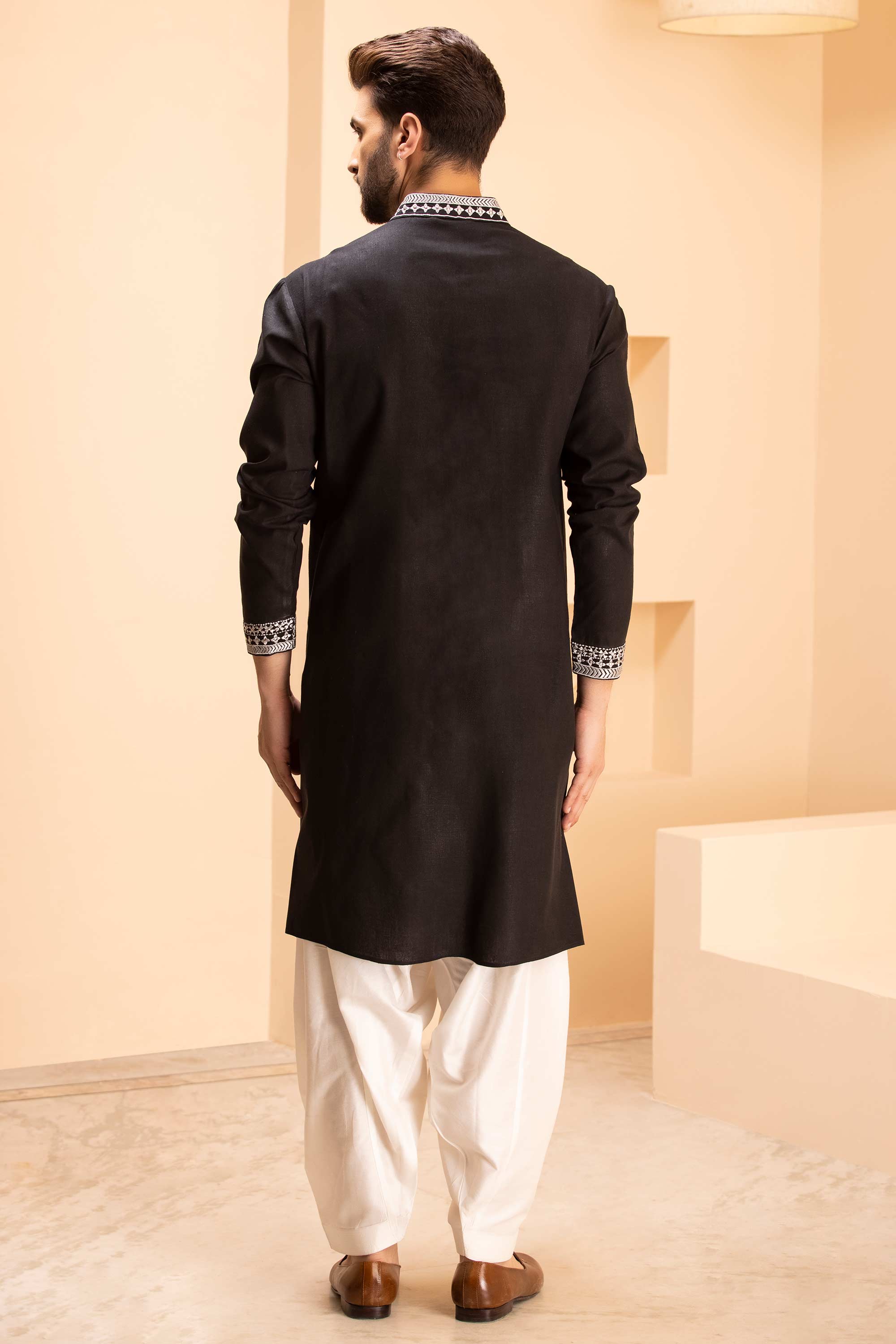 Linen kurta with zari embroidery & metal work paired with salwar