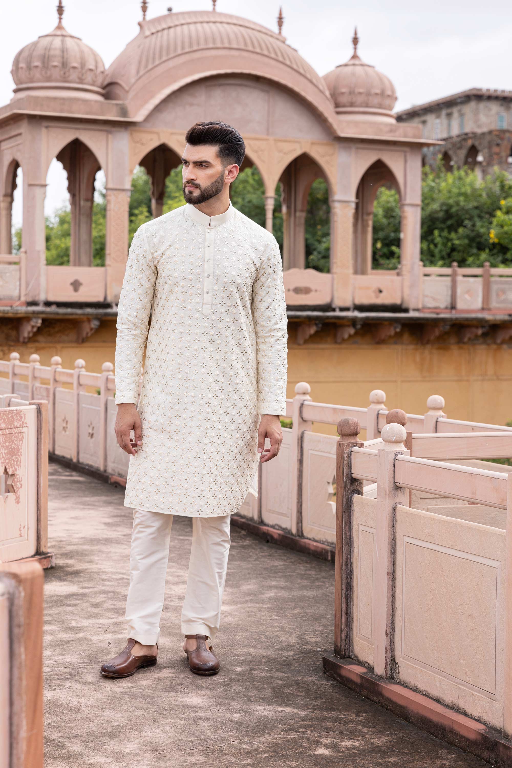 Metal work kurta paired with aligadhi.