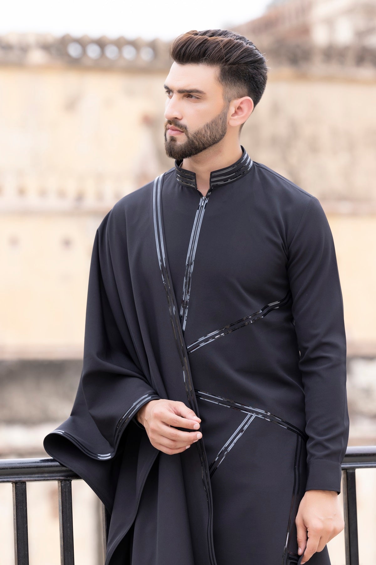 Tape work kurta paired with aligadhi and a stole.