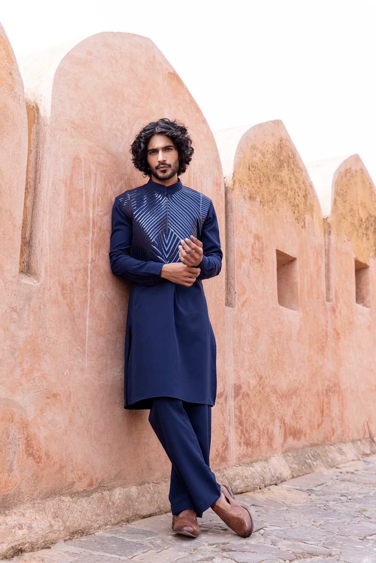 Tape work kurta paired with aligadhi.