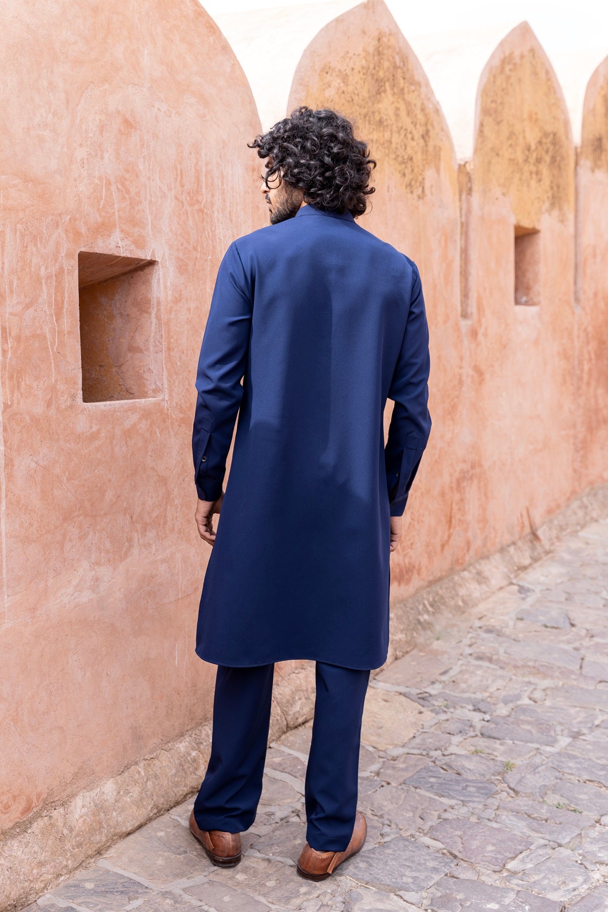 Tape work kurta paired with aligadhi.