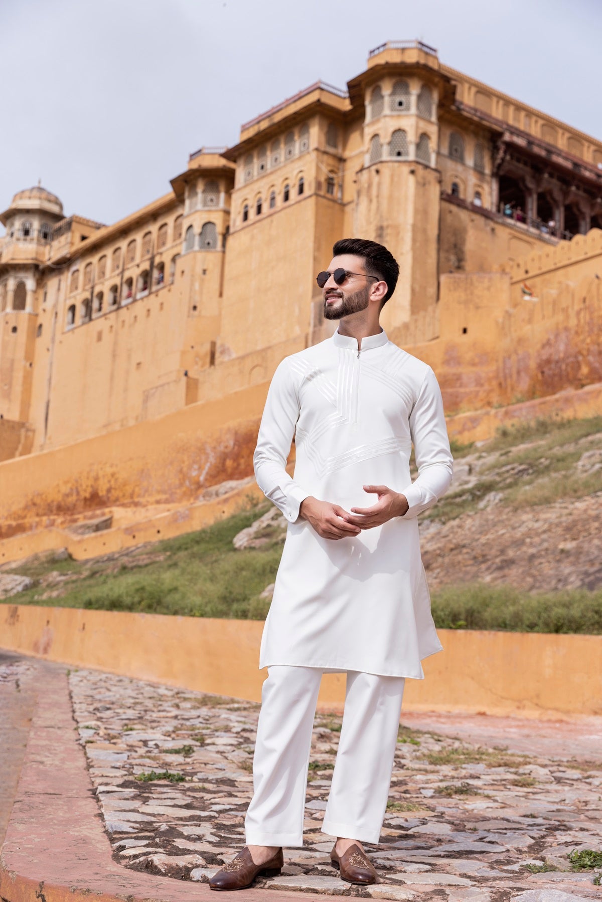 Tape work kurta paired with aligadhi.