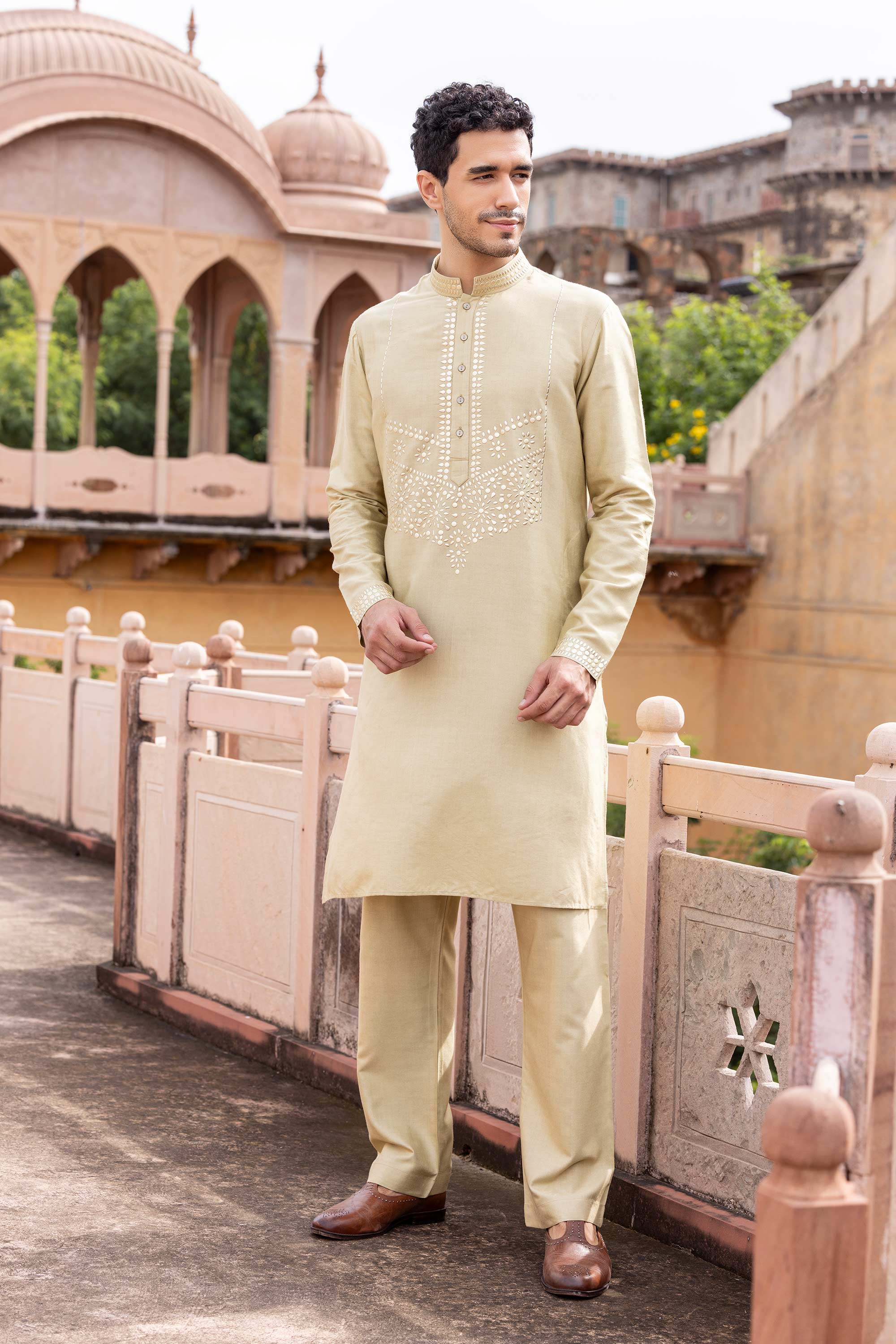 Metal work kurta paired with aligadhi.