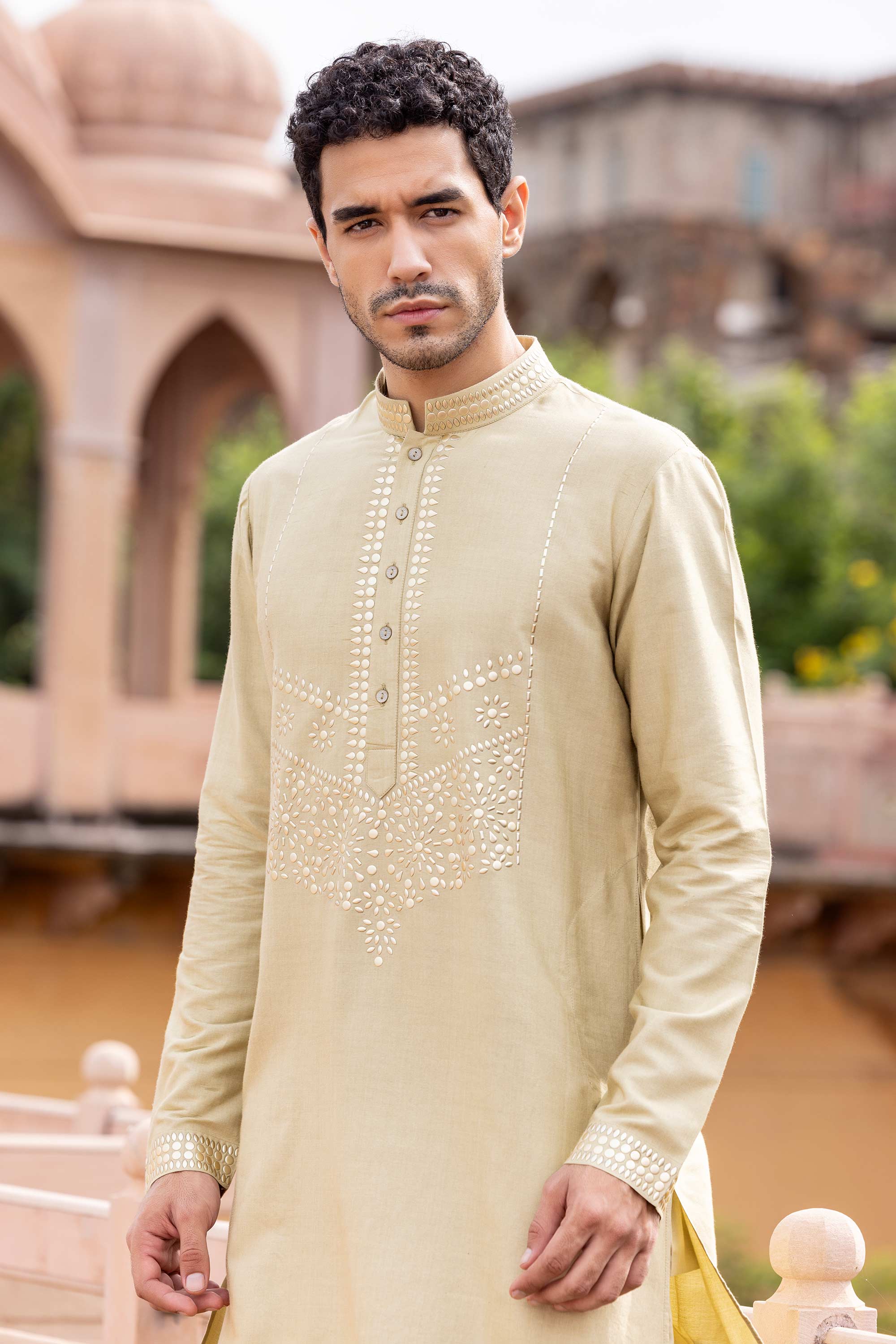 Metal work kurta paired with aligadhi.