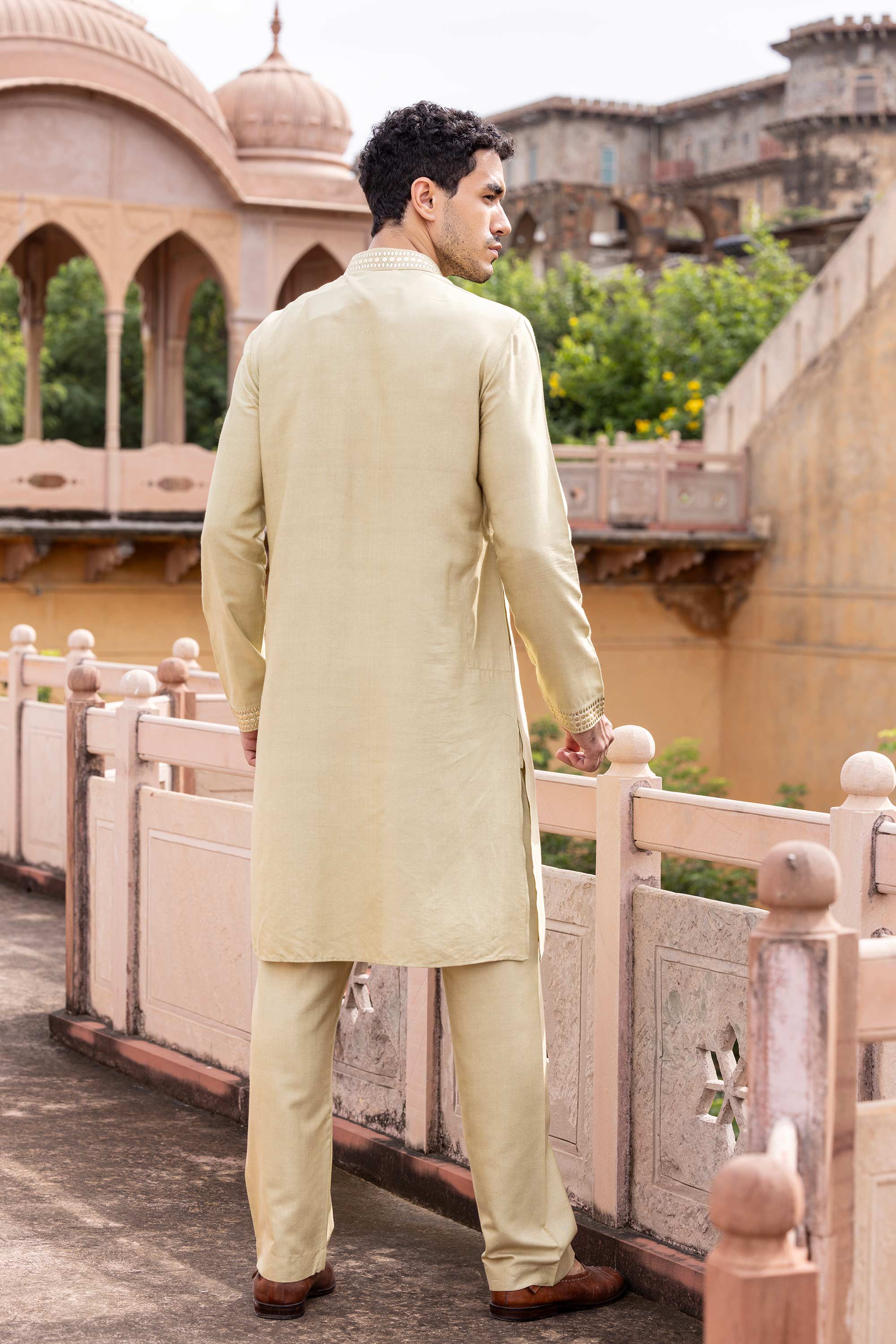 Metal work kurta paired with aligadhi.