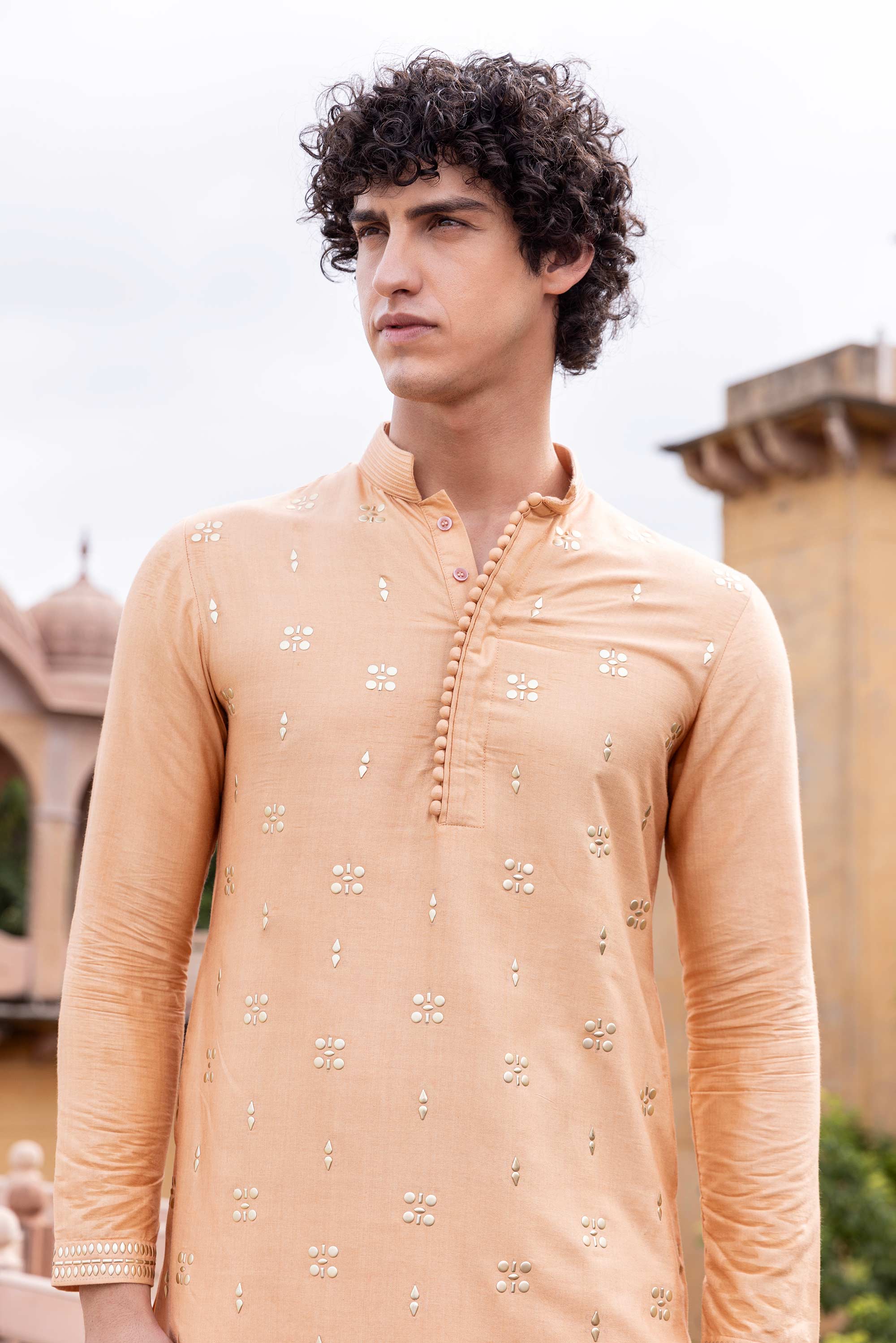 Metal work kurta paired with aligadhi.