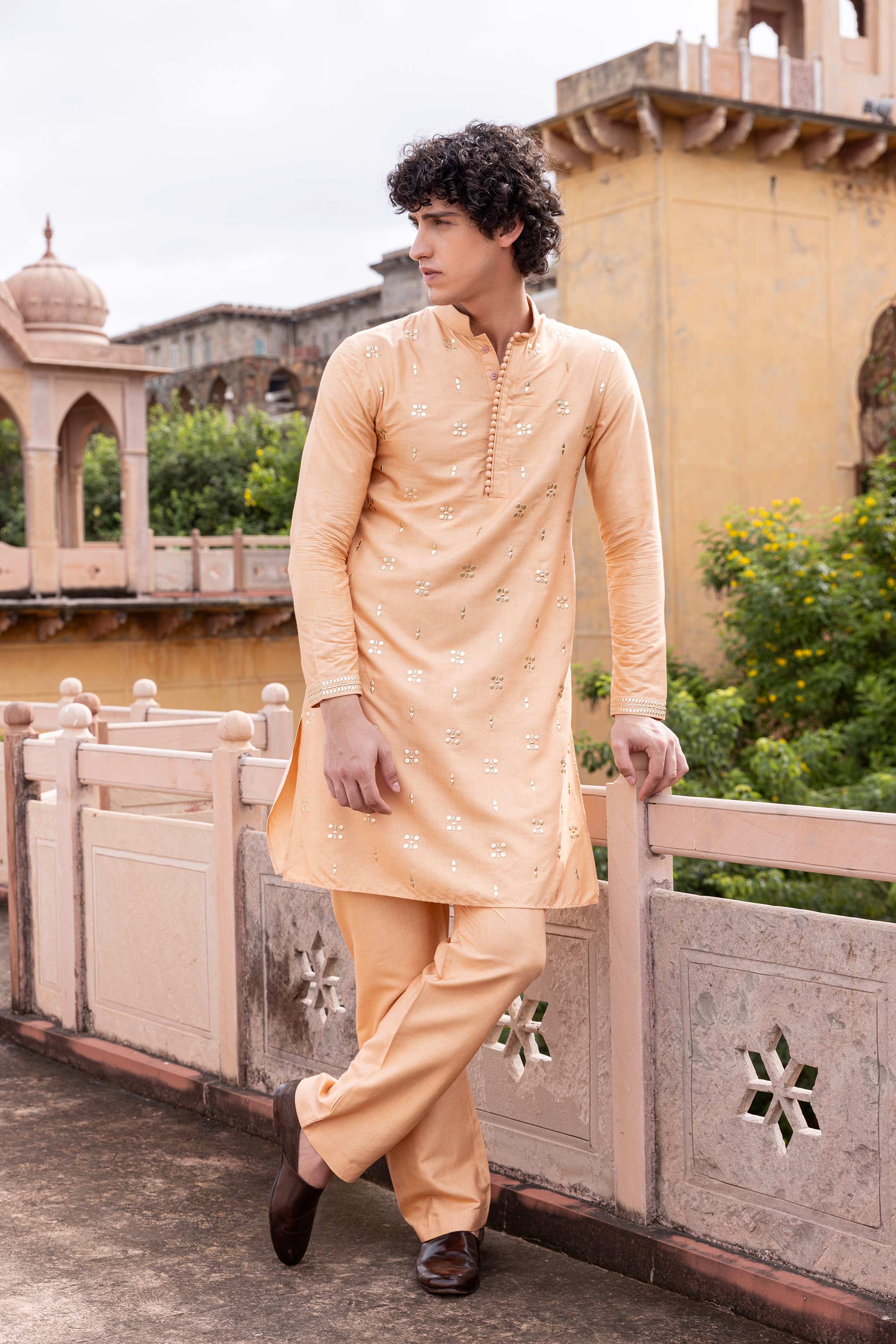 Metal work kurta paired with aligadhi.