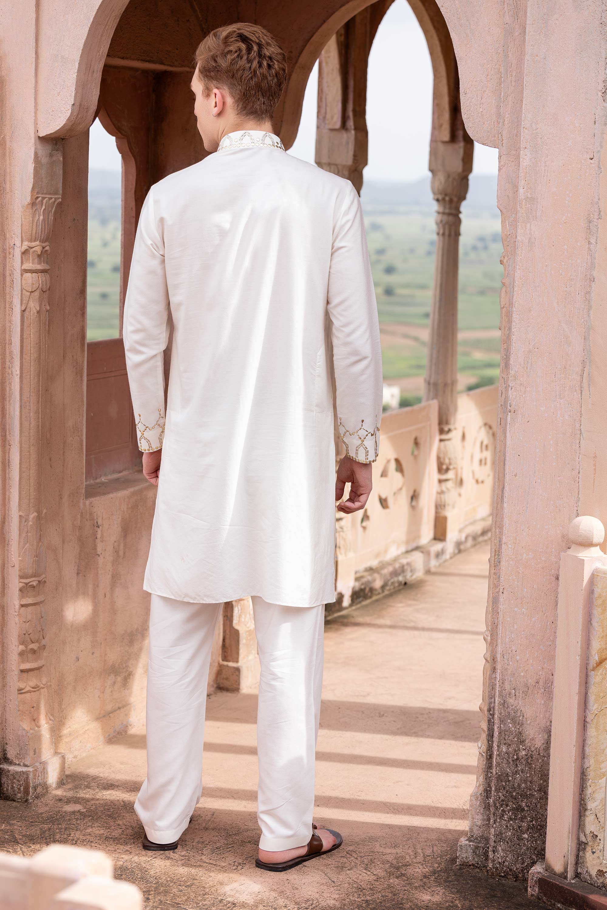 Metal work kurta paired with aligadhi.