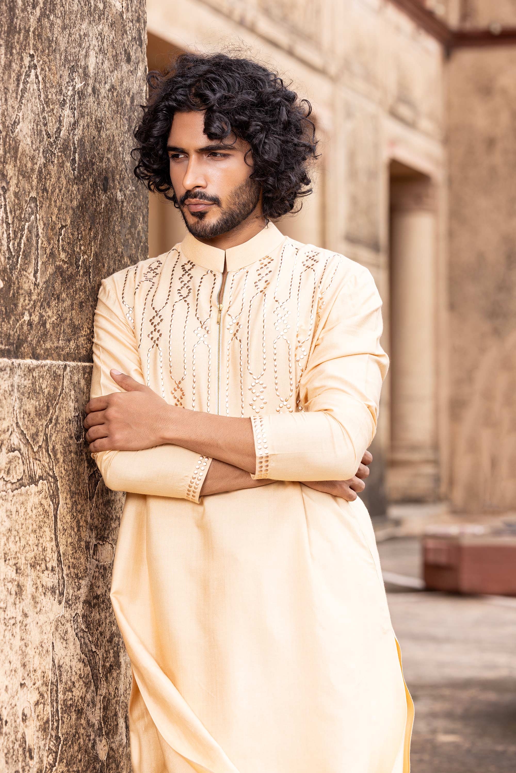Metal work kurta paired with aligadhi.