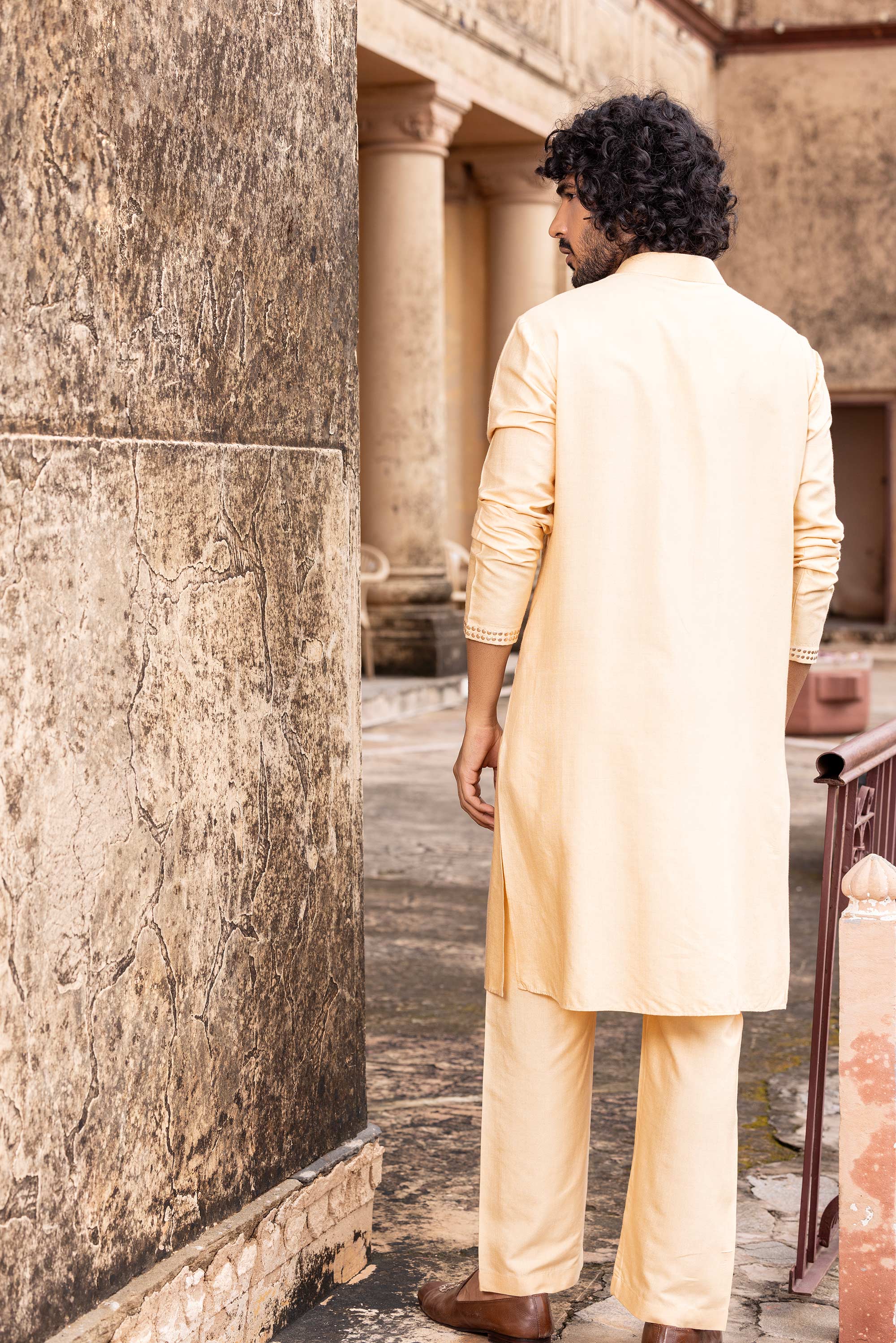 Metal work kurta paired with aligadhi.