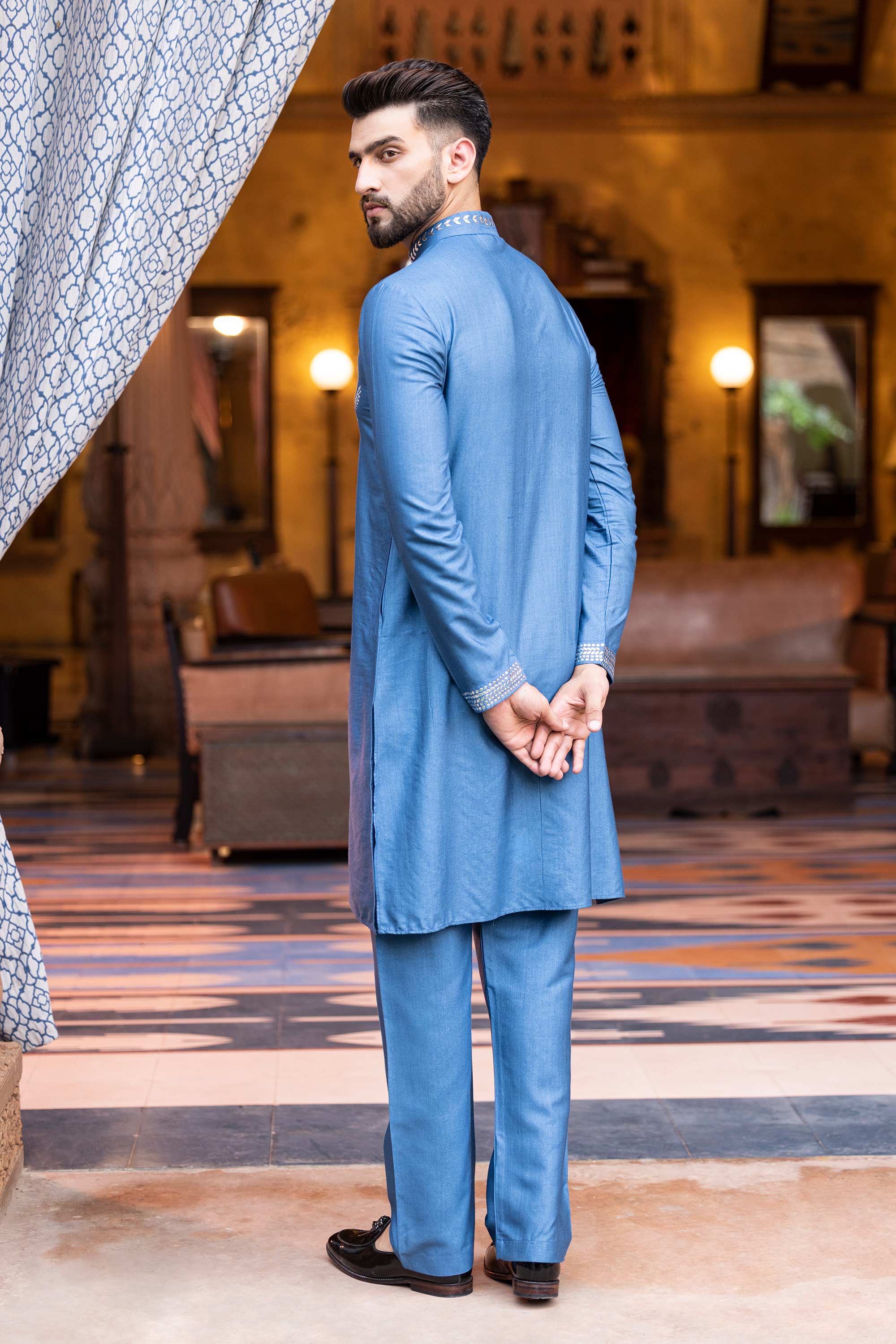 Metal work kurta paired with aligadhi.