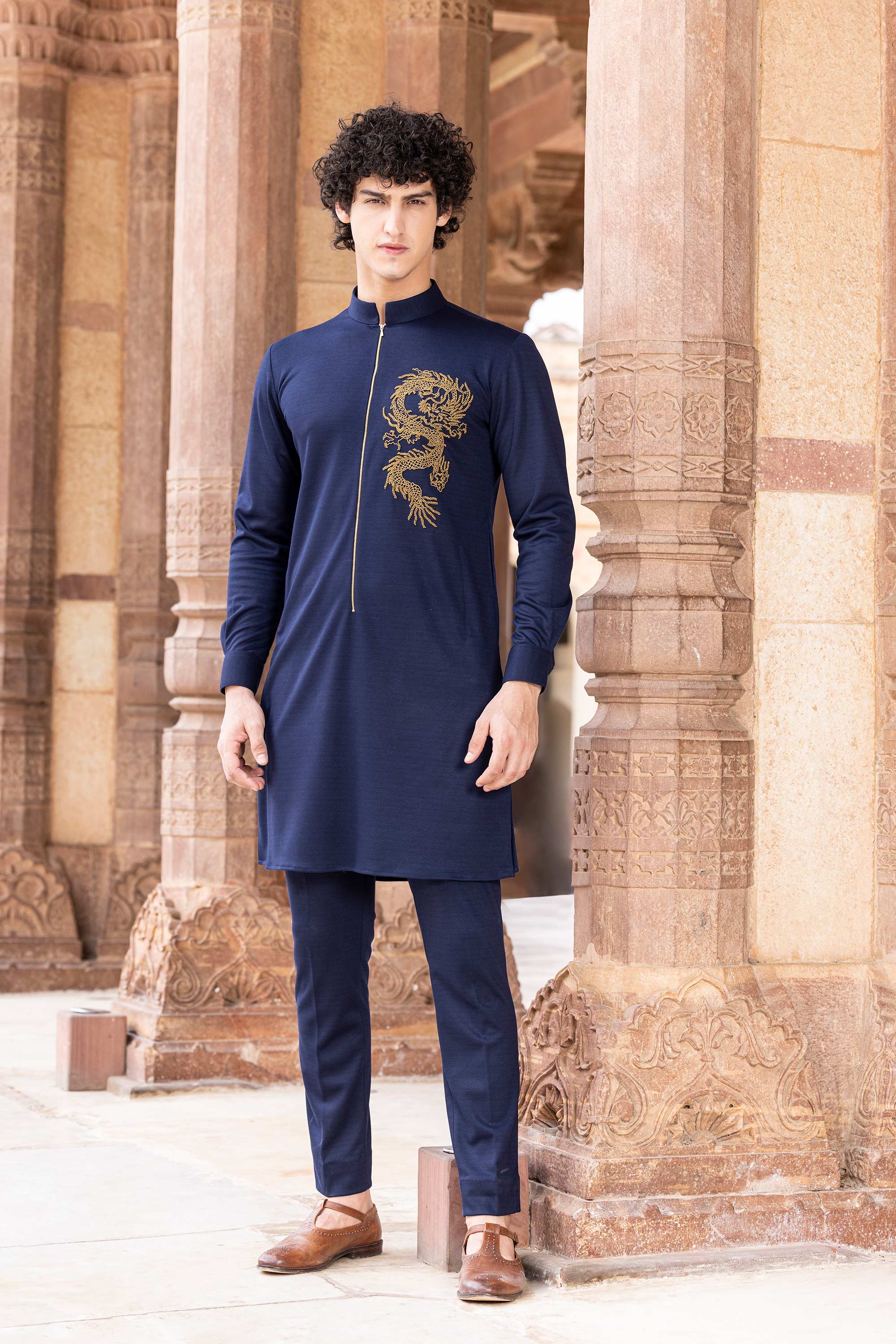 Knit kurta embellished with hand embroidered Dragon motif.
