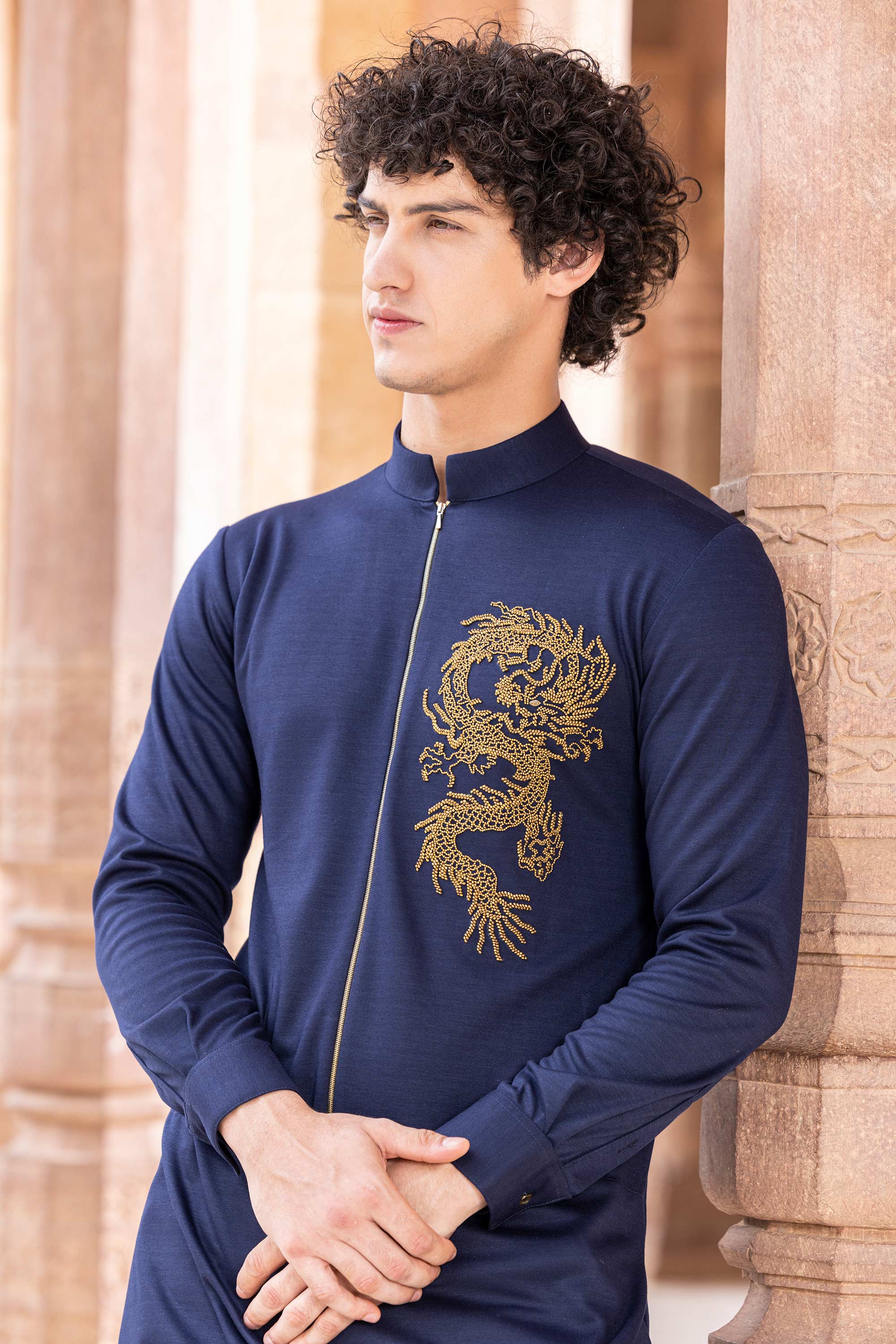 Knit kurta embellished with hand embroidered Dragon motif.