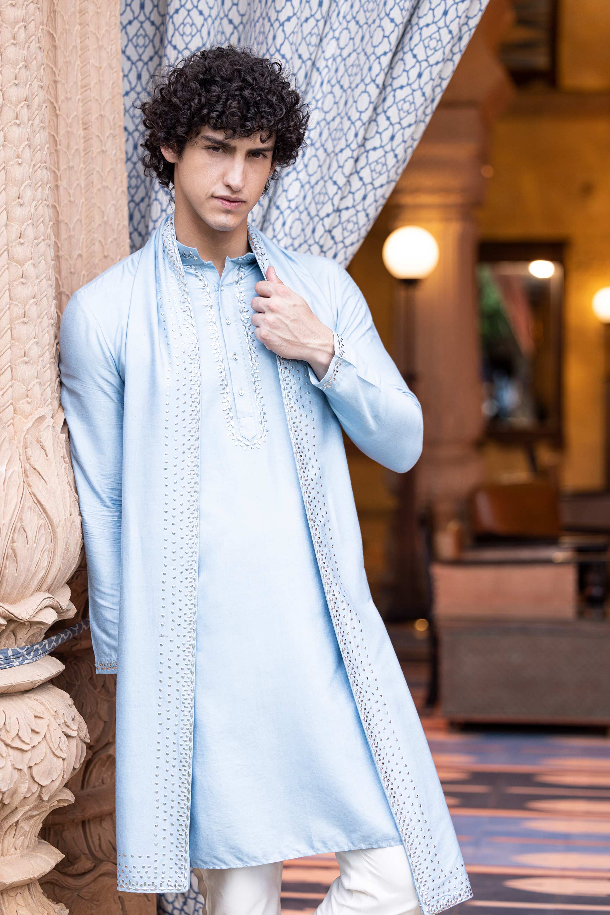 Metal work kurta paired with aligadhi and a stole.
