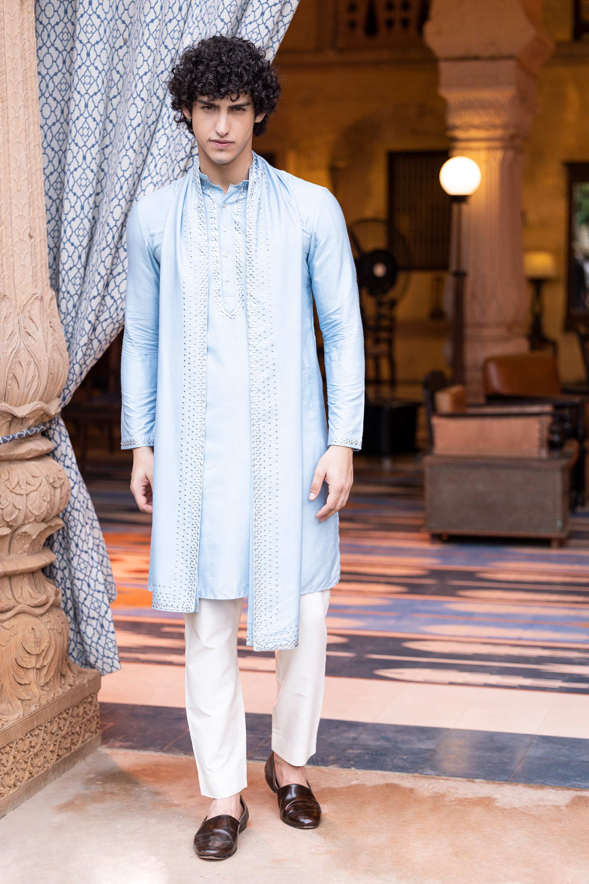 Metal work kurta paired with aligadhi and a stole.