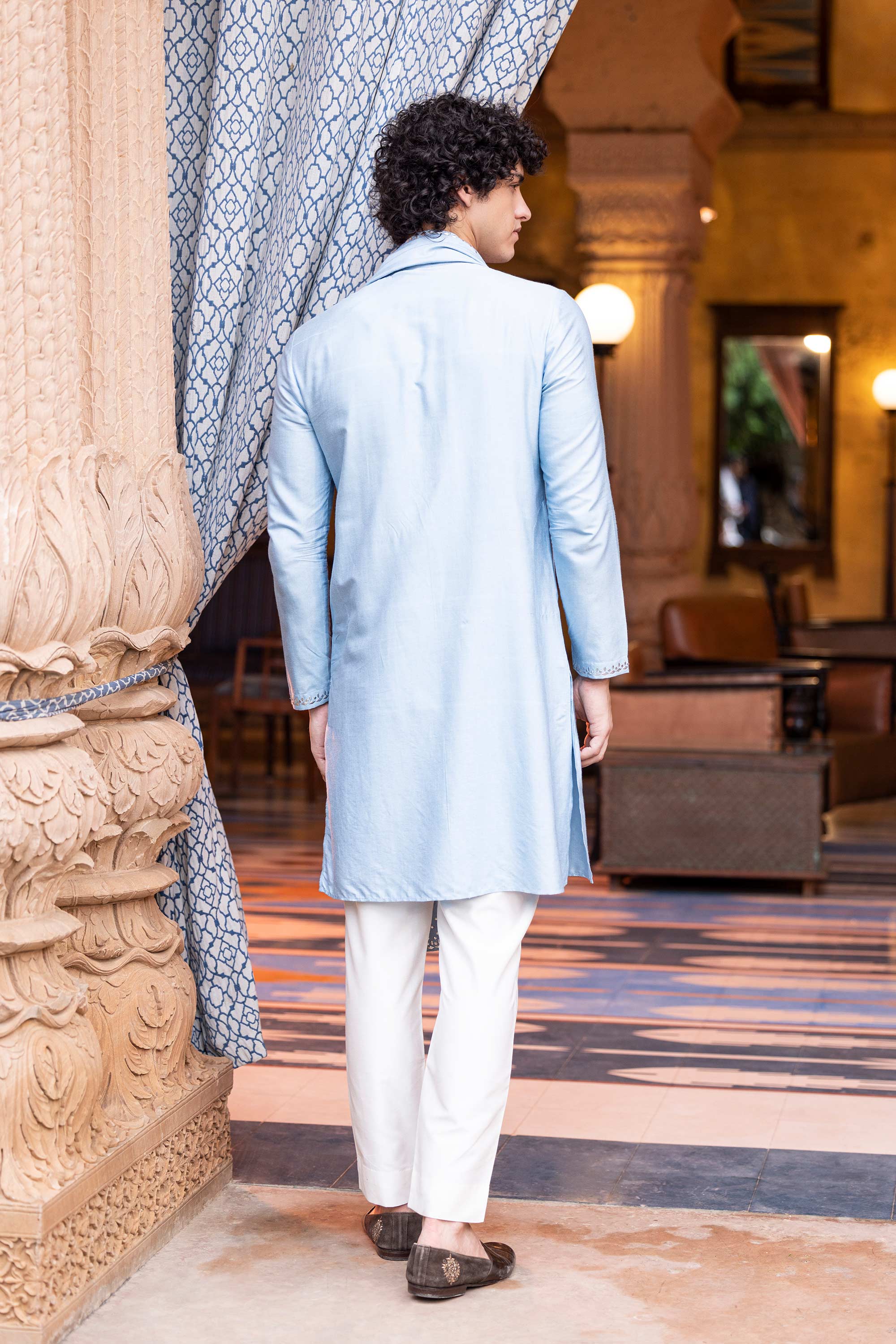 Metal work kurta paired with aligadhi and a stole.