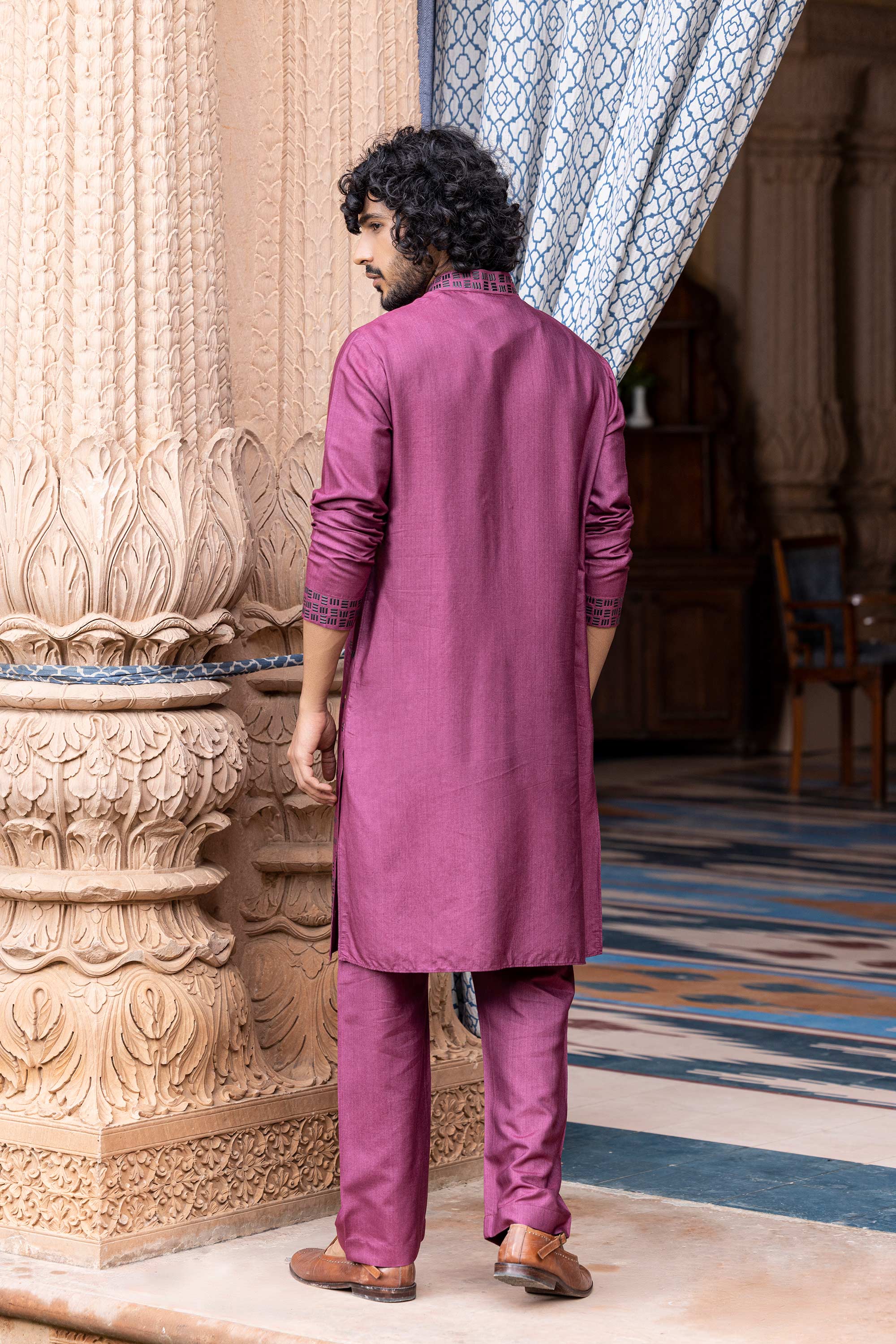 Metal work kurta paired with aligadhi.