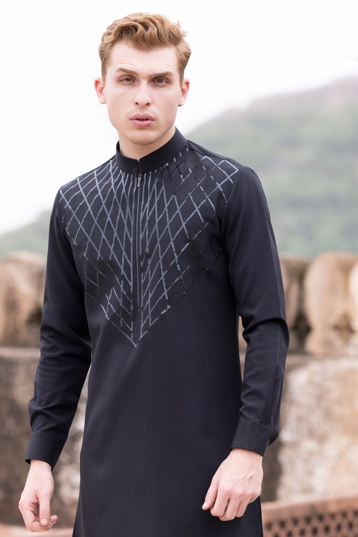 Tape work kurta paired with aligadhi.