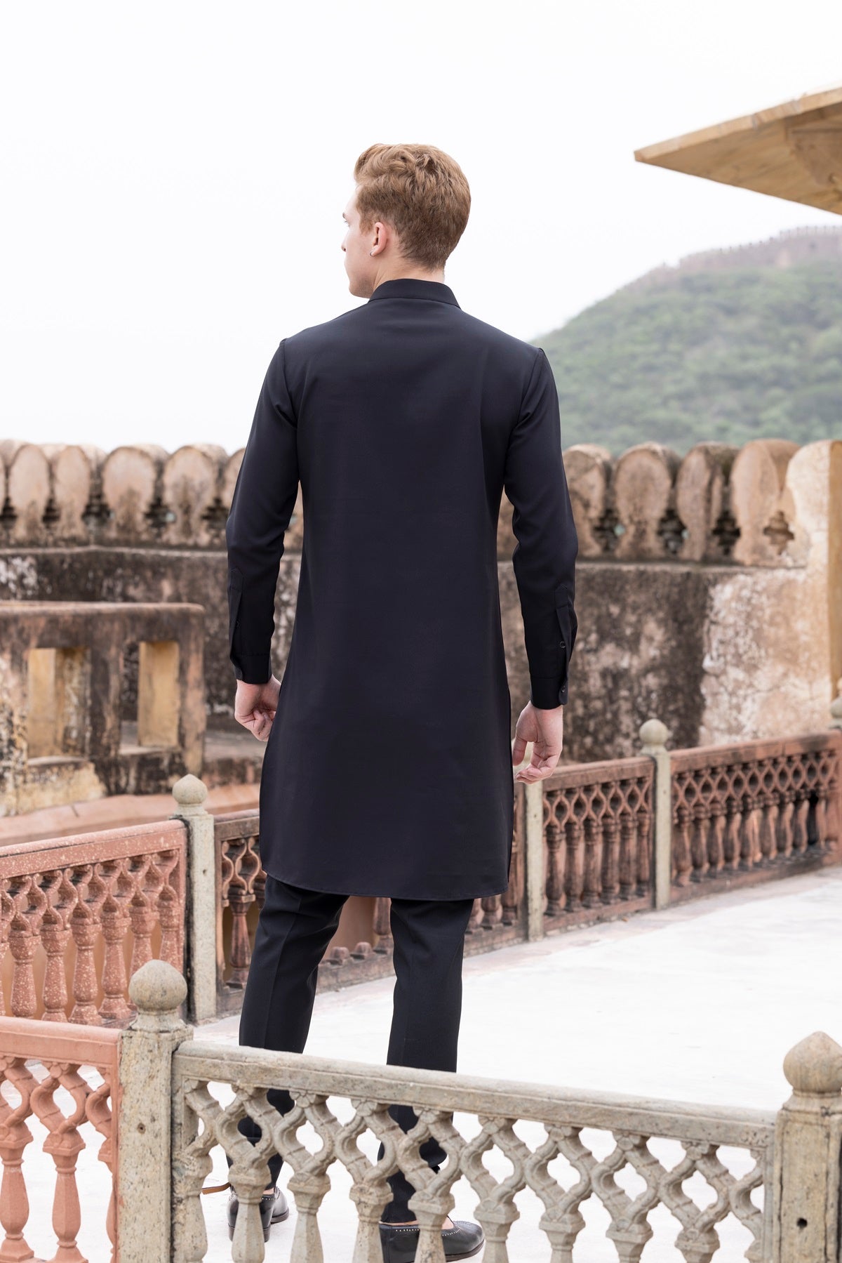 Tape work kurta paired with aligadhi.